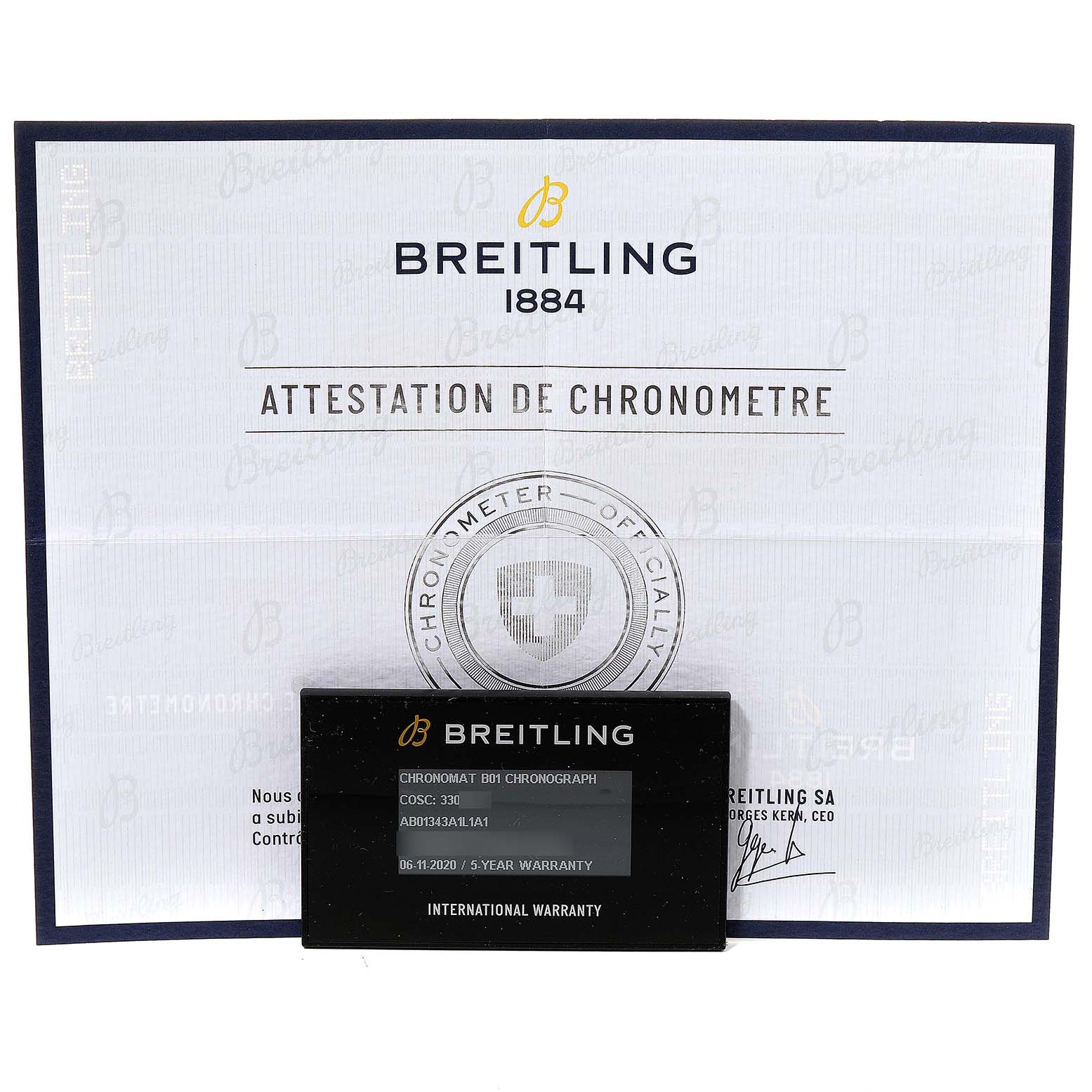 The image shows the Chronomat model by Breitling's Attestation de Chronometre certificate and international warranty card.