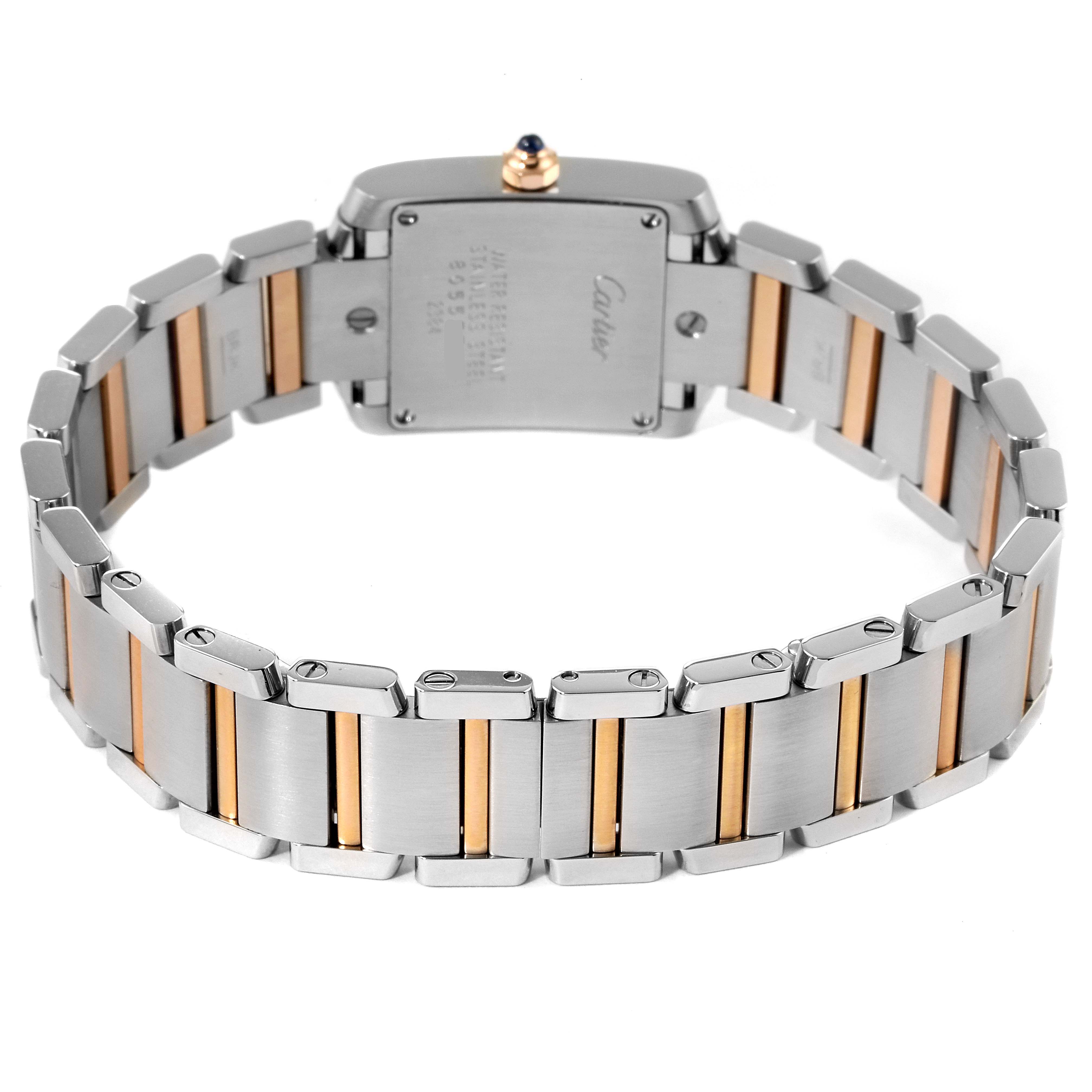 The image shows the back view of a Cartier Tank Française watch, highlighting its stainless steel and gold bracelet.