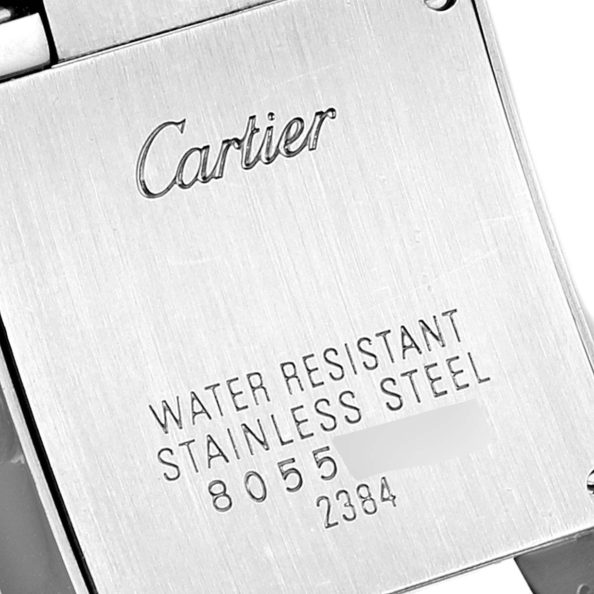 The image shows the case back of a Cartier Tank Francaise W51027Q4 Women's Steel and Gold (two tone) Mother of Pearl Dial W51027Q4 Women's Steel and Gold (two tone) Mother of Pearl Dial watch.