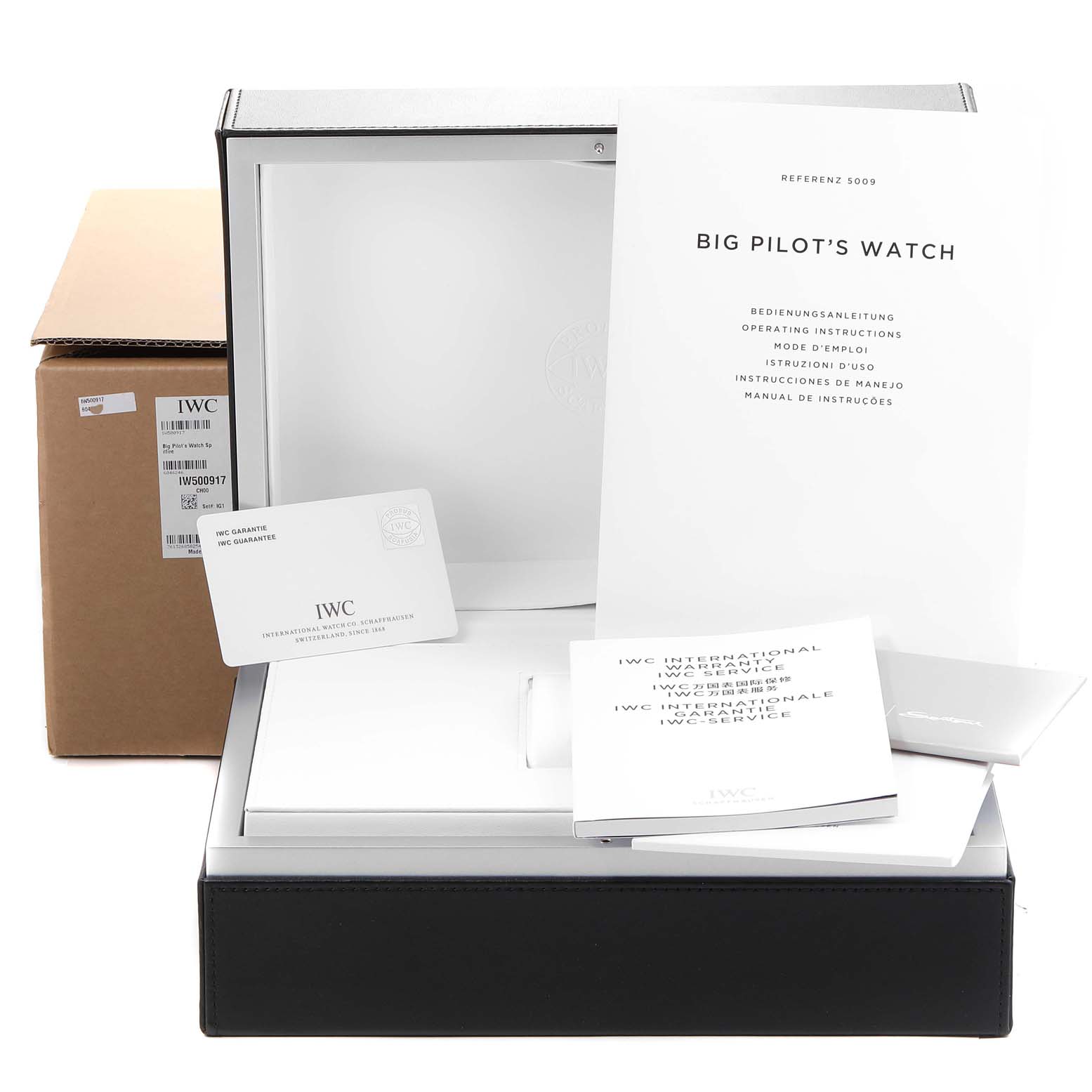 The image shows a package with manuals and warranties for the IWC Big Pilot's Watch, displayed from a front angle.