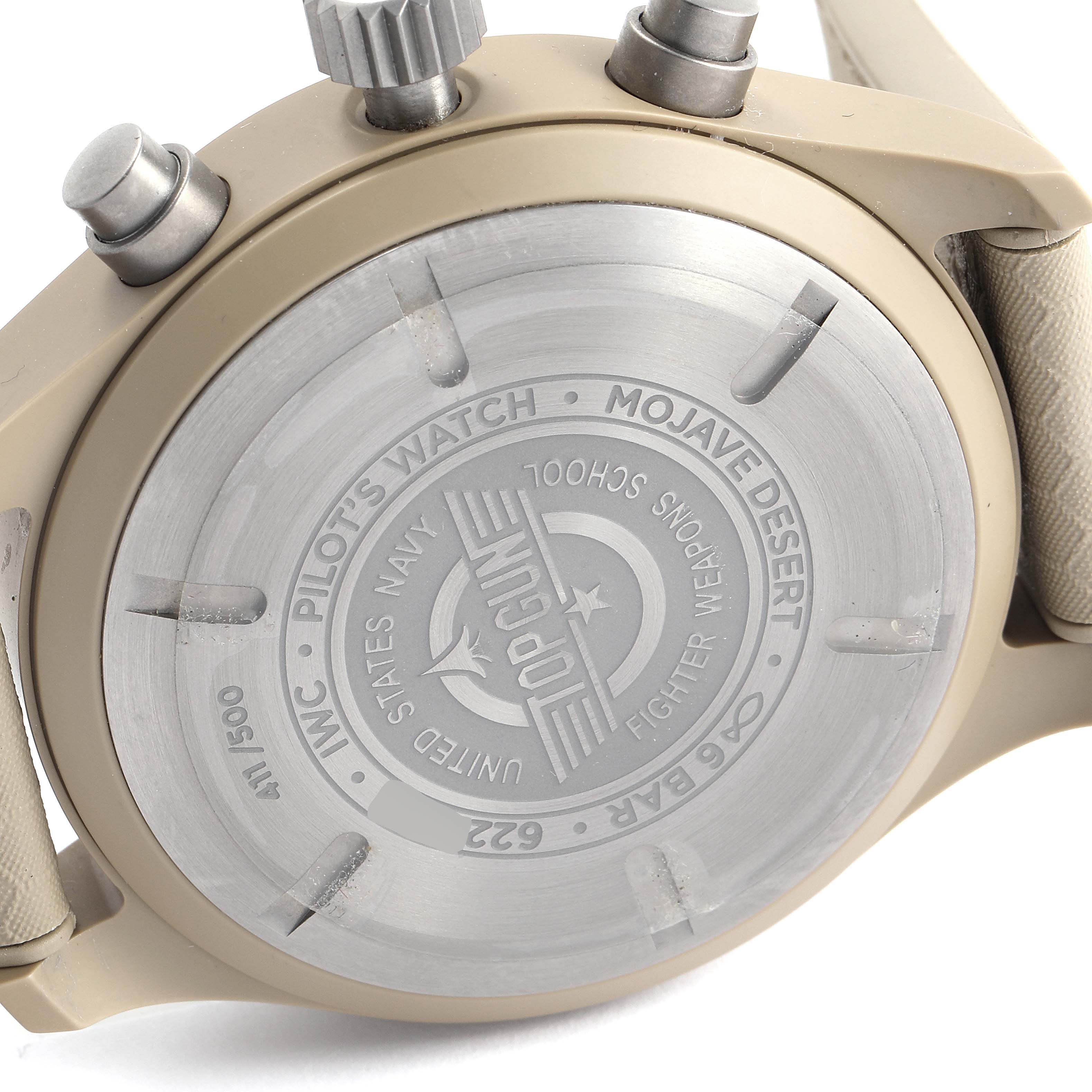 The image shows the back case and crown of the IWC Pilot IW389103 Men's Titanium Brown Dial IW389103 Men's Titanium Brown Dial's Watch Mojave Desert Top Gun model.