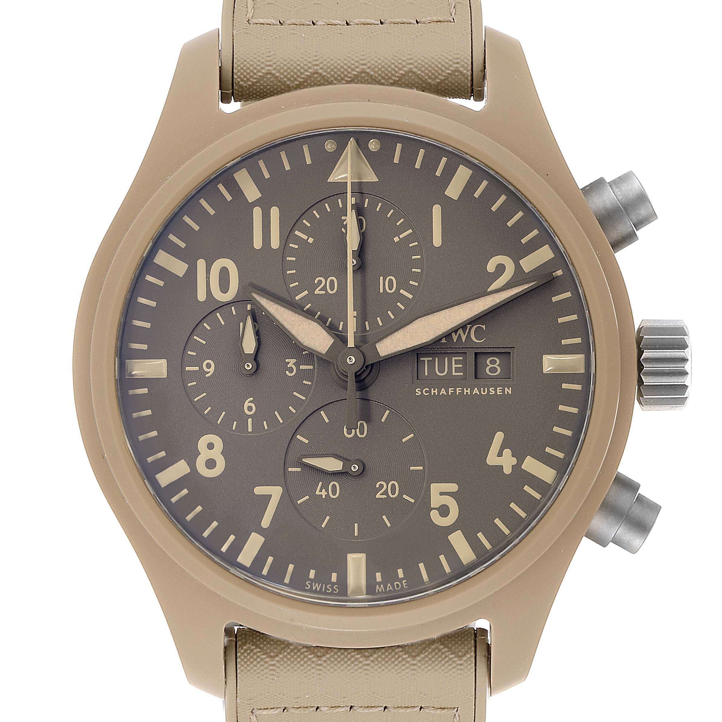 The image shows a top-down view of the IWC Pilot IW389103 Men's Titanium Brown Dial IW389103 Men's Titanium Brown Dial watch, highlighting its beige case, chronograph subdials, and beige strap.