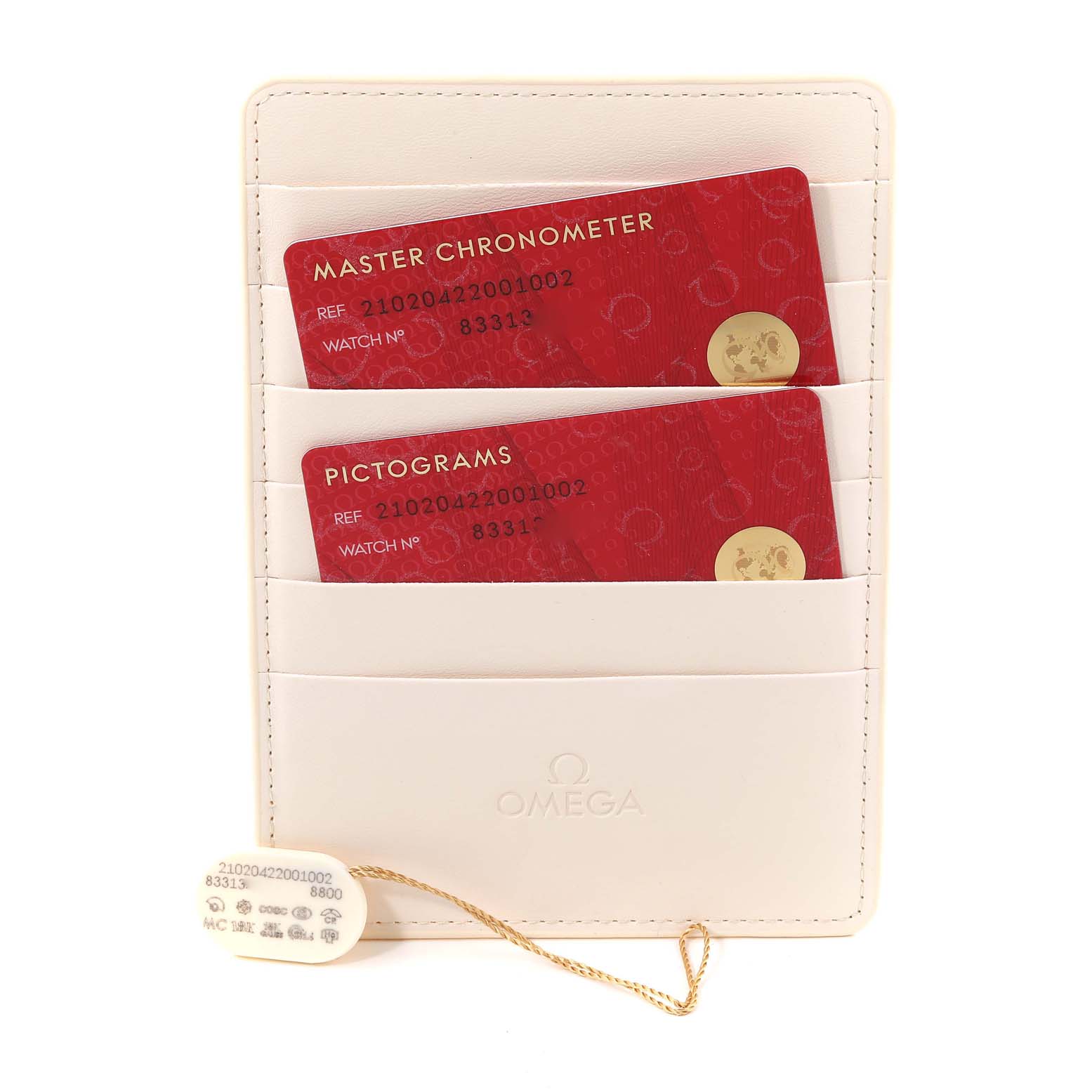 The image shows a white Omega cardholder with Master Chronometer and Pictograms cards for a Seamaster model.