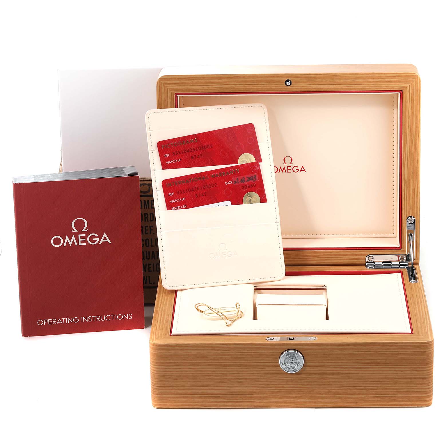 The image shows the box and documentation for an Omega Speedmaster 331.10.42.51.01.002 Men's Stainless Steel Black Dial 331.10.42.51.01.002 Men's Stainless Steel Black Dial watch, including the operating instructions and warranty cards.