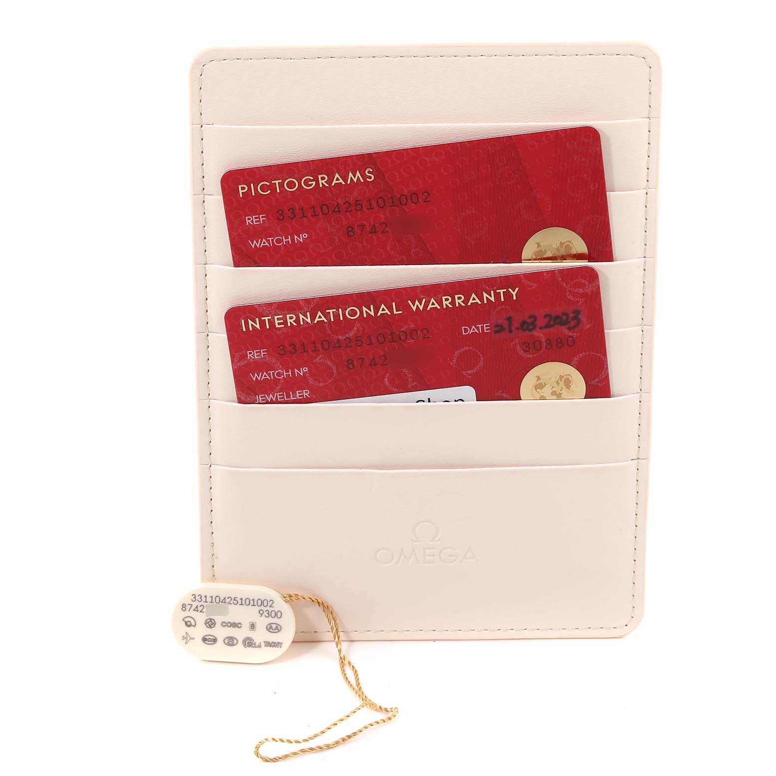 The image shows the International Warranty and Pictograms cards for an Omega Speedmaster 331.10.42.51.01.002 Men's Stainless Steel Black Dial 331.10.42.51.01.002 Men's Stainless Steel Black Dial, along with a serial hangtag.