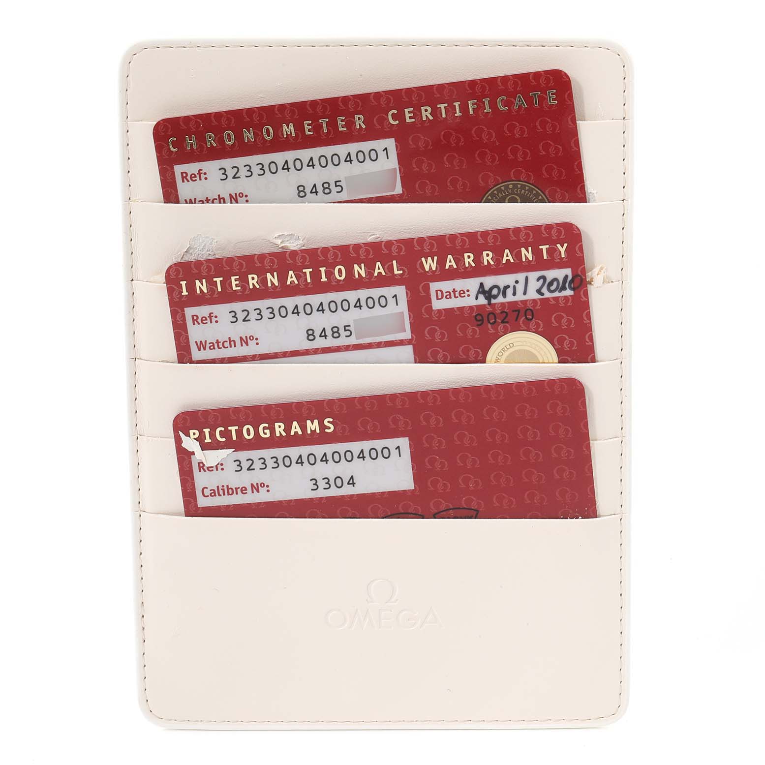 The image shows an Omega Speedmaster 323.30.40.40.04.001 Men's Stainless Steel White Dial 323.30.40.40.04.001 Men's Stainless Steel White Dial's Chronometer Certificate, International Warranty, and Pictograms cards in a cardholder.