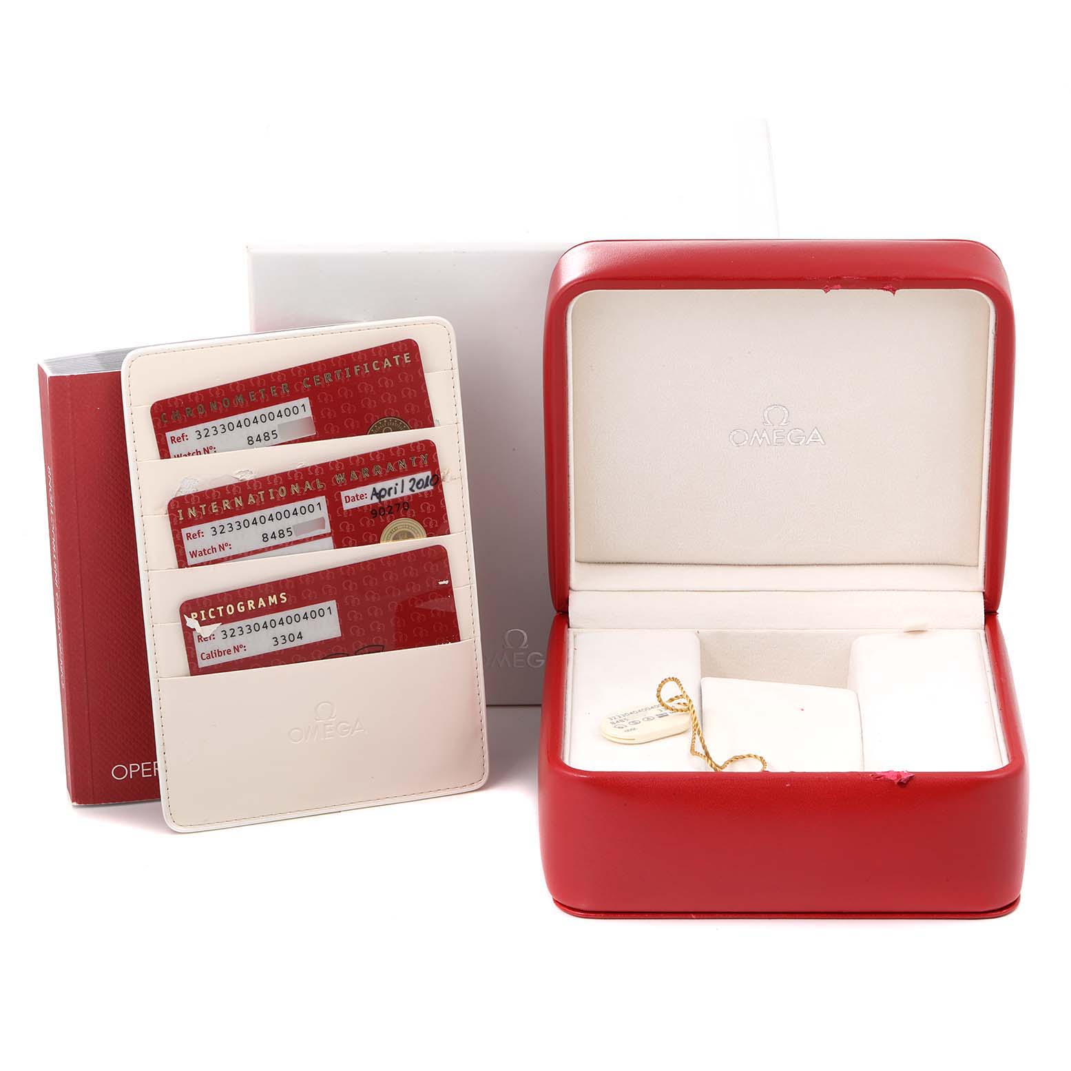 This image shows the packaging and accessories for the Omega Speedmaster 323.30.40.40.04.001 Men's Stainless Steel White Dial 323.30.40.40.04.001 Men's Stainless Steel White Dial, featuring a red watch box, warranty cards, and an instruction manual.