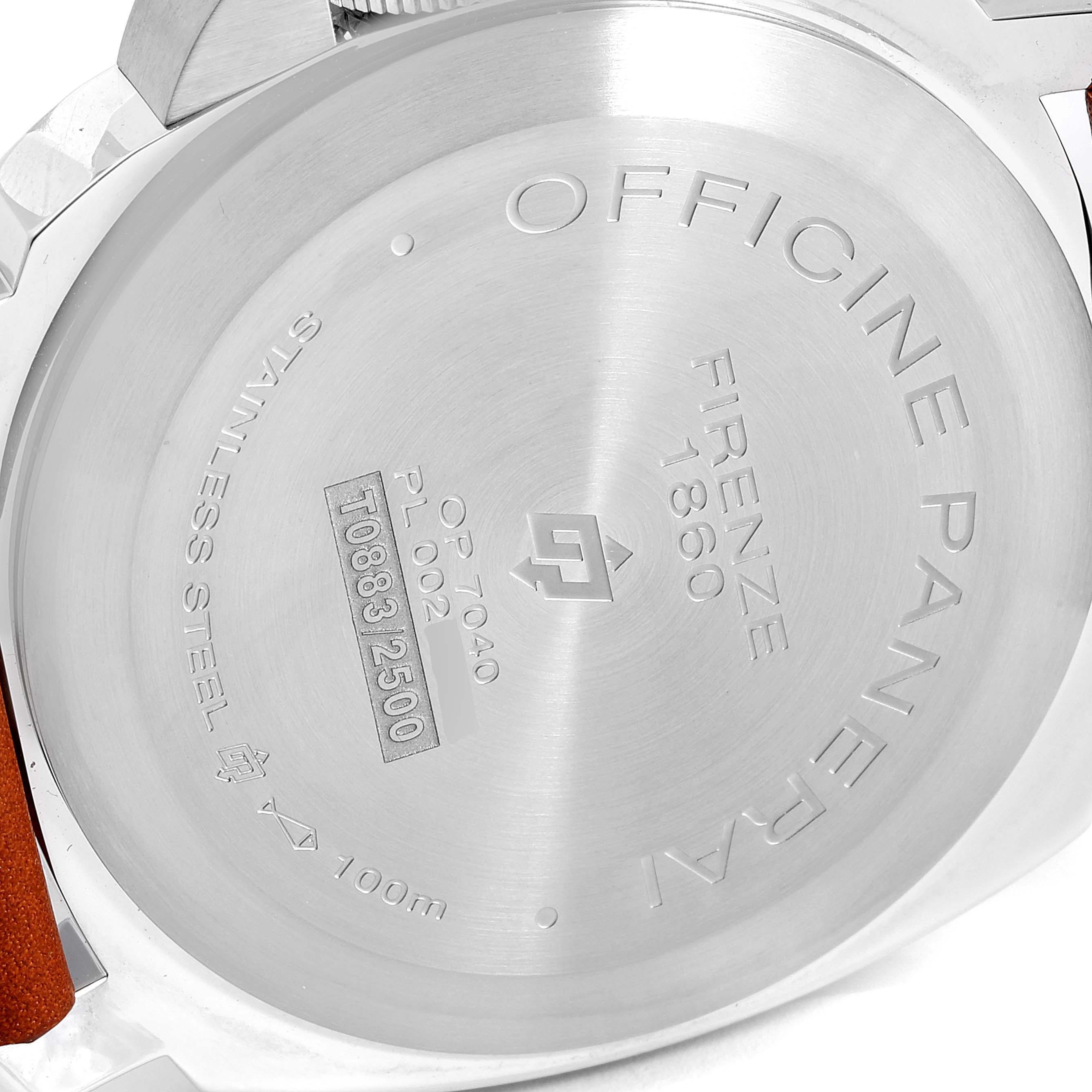 The image shows the back case of a Luminor model watch by Panerai, featuring engravings with the brand's details.