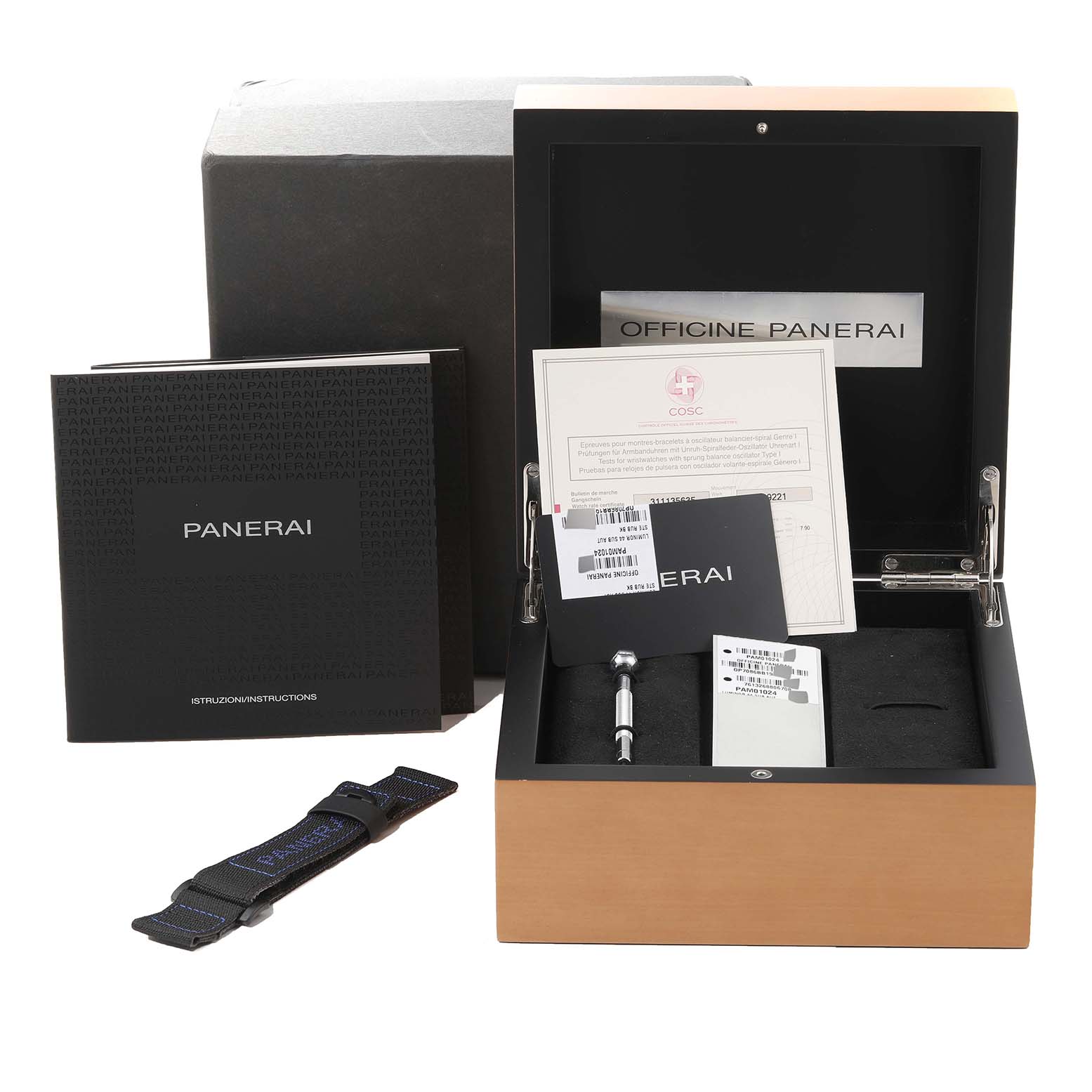 This image shows an open box of the Panerai Luminor PAM01024 Men
s Stainless Steel Black Dial PAM01024 Men
s Stainless Steel Black Dial model watch along with its accessories and documentation.