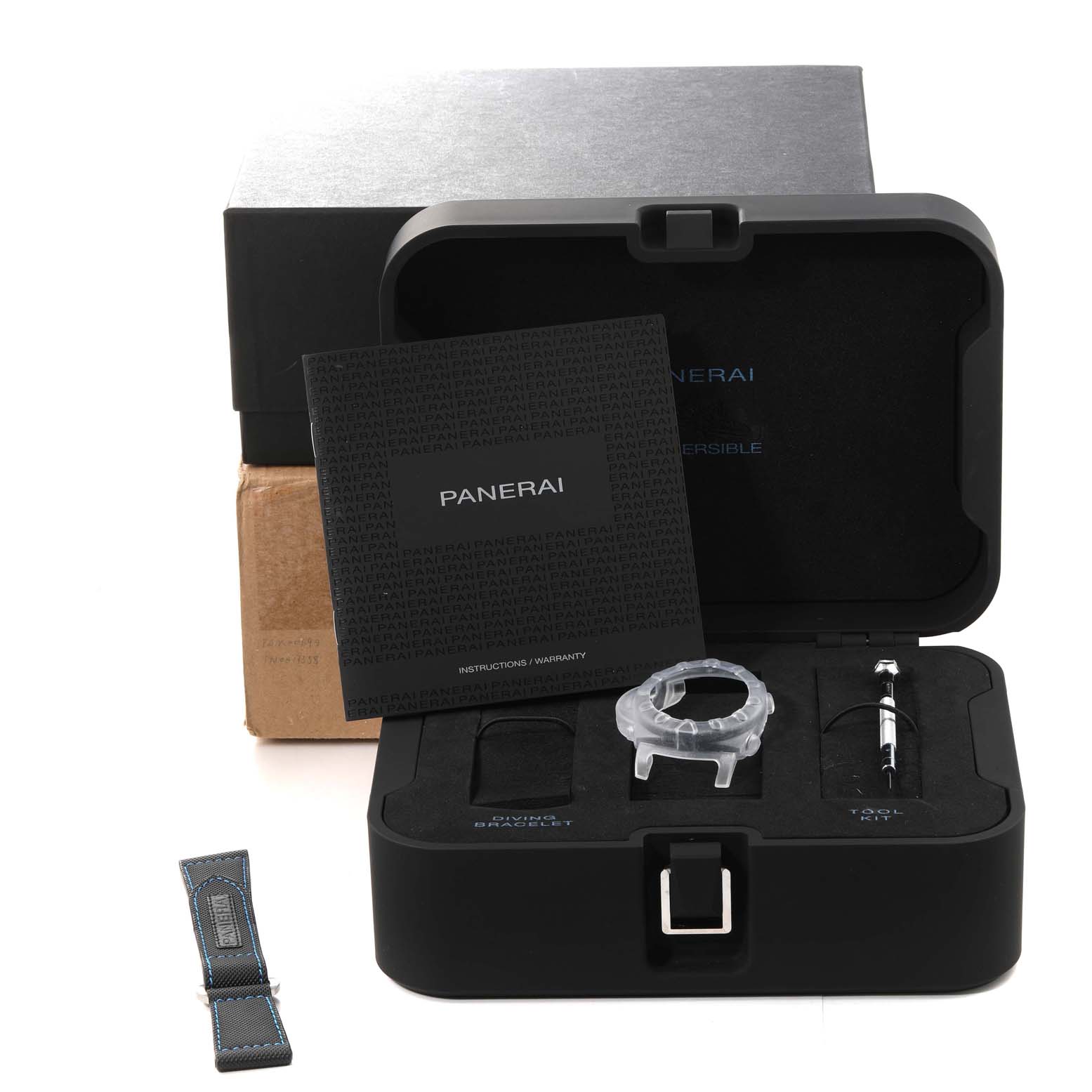 The image shows a Panerai Submersible PAM00692 Men's Titanium Blue Dial PAM00692 Men's Titanium Blue Dial watch set with accessories, including a manual, a diving bracelet, and a tool kit, displayed in a box.