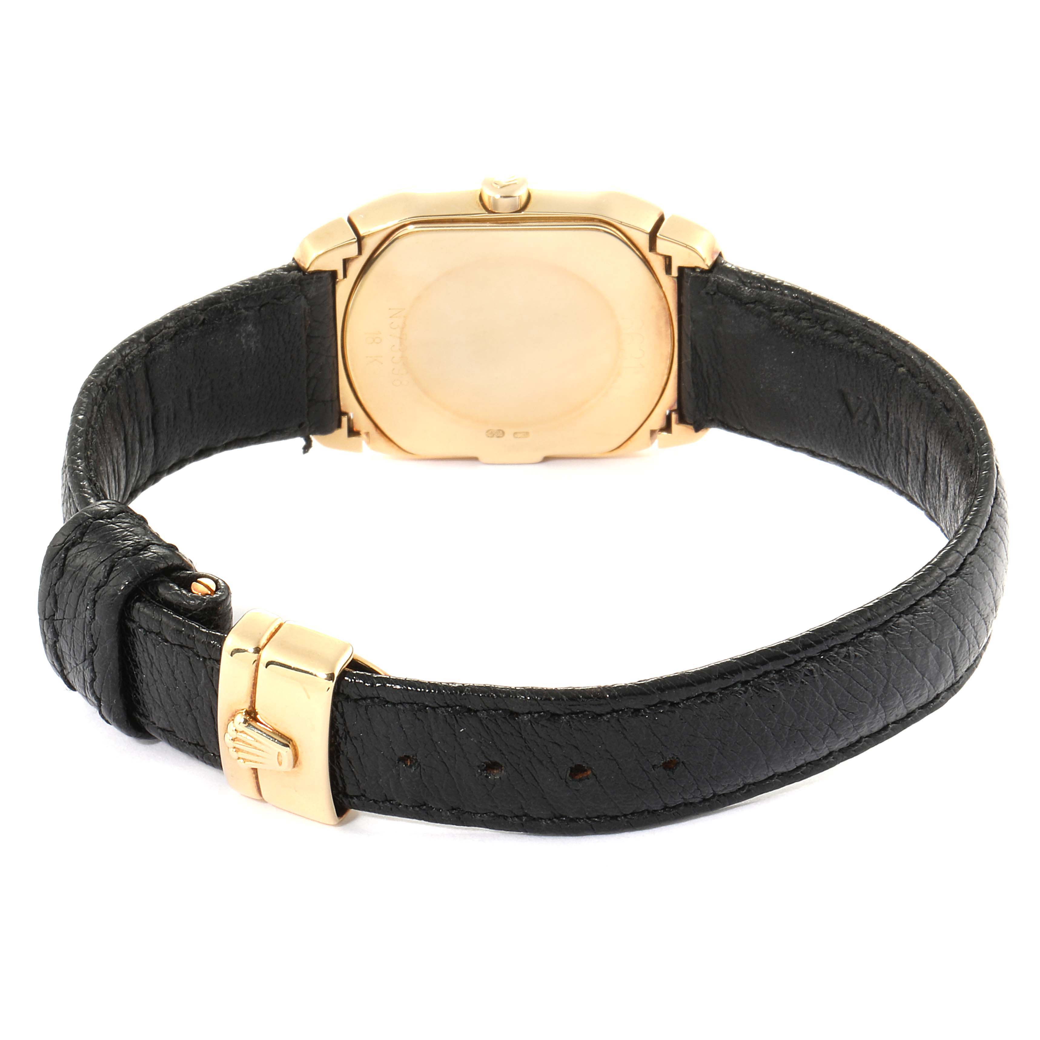 This image shows the back of a gold-case Rolex Cellini 6691 Women's Yellow Gold White Dial 6691 Women's Yellow Gold White Dial watch, including its black leather strap and gold buckle.