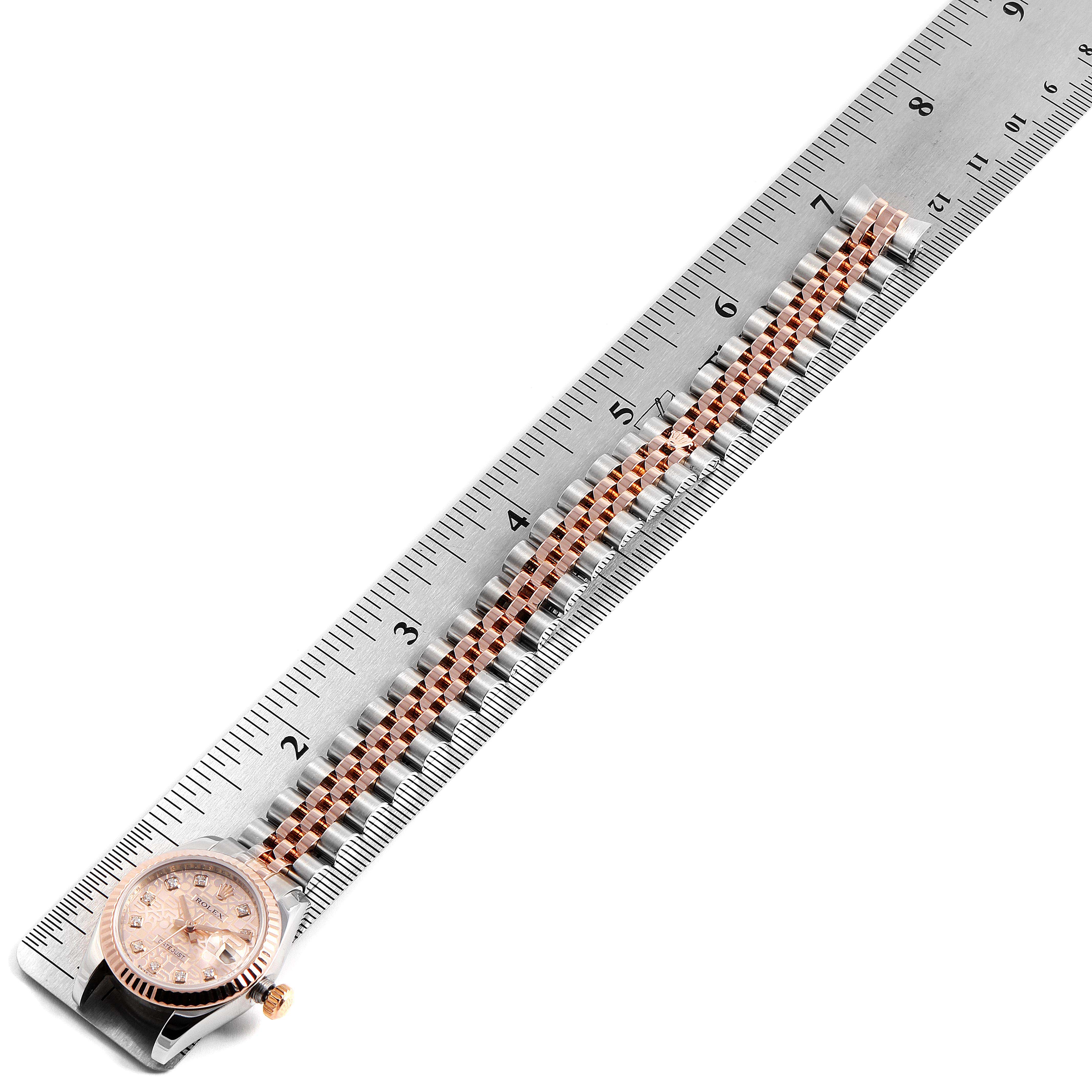 The image shows the Rolex Datejust 179171 Women's Rose Gold Pink Dial 179171 Women's Rose Gold Pink Dial watch face and bracelet, measured against a ruler for scale.