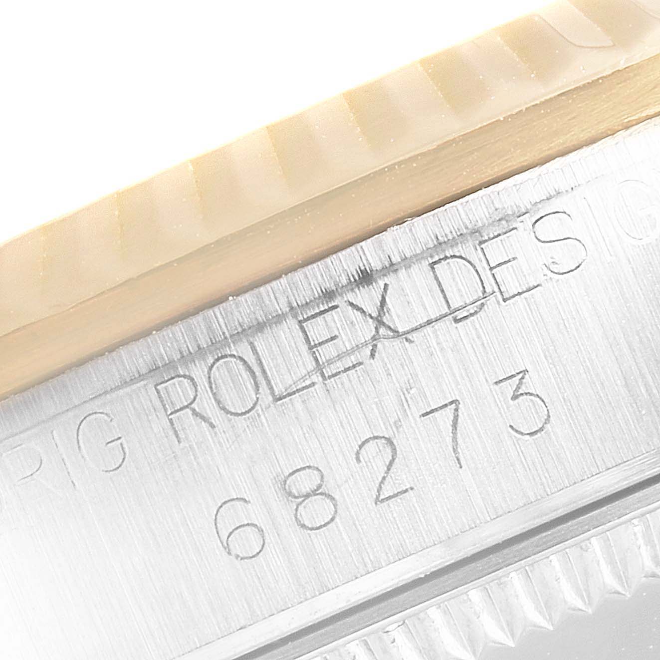 The image shows a close-up of the case side of a Mid-Size Rolex watch, featuring the model number 68273 engraved on the metal.