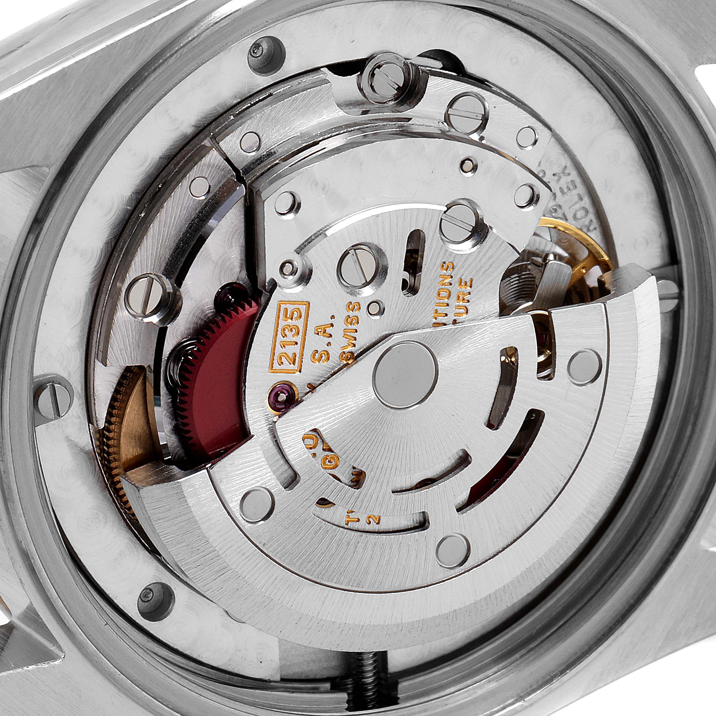 This image shows the intricate internal mechanism of a Rolex Mid-Size 68273 Women's Steel and Gold (two tone) White Dial 68273 Women's Steel and Gold (two tone) White Dial watch from a close-up, angled view.