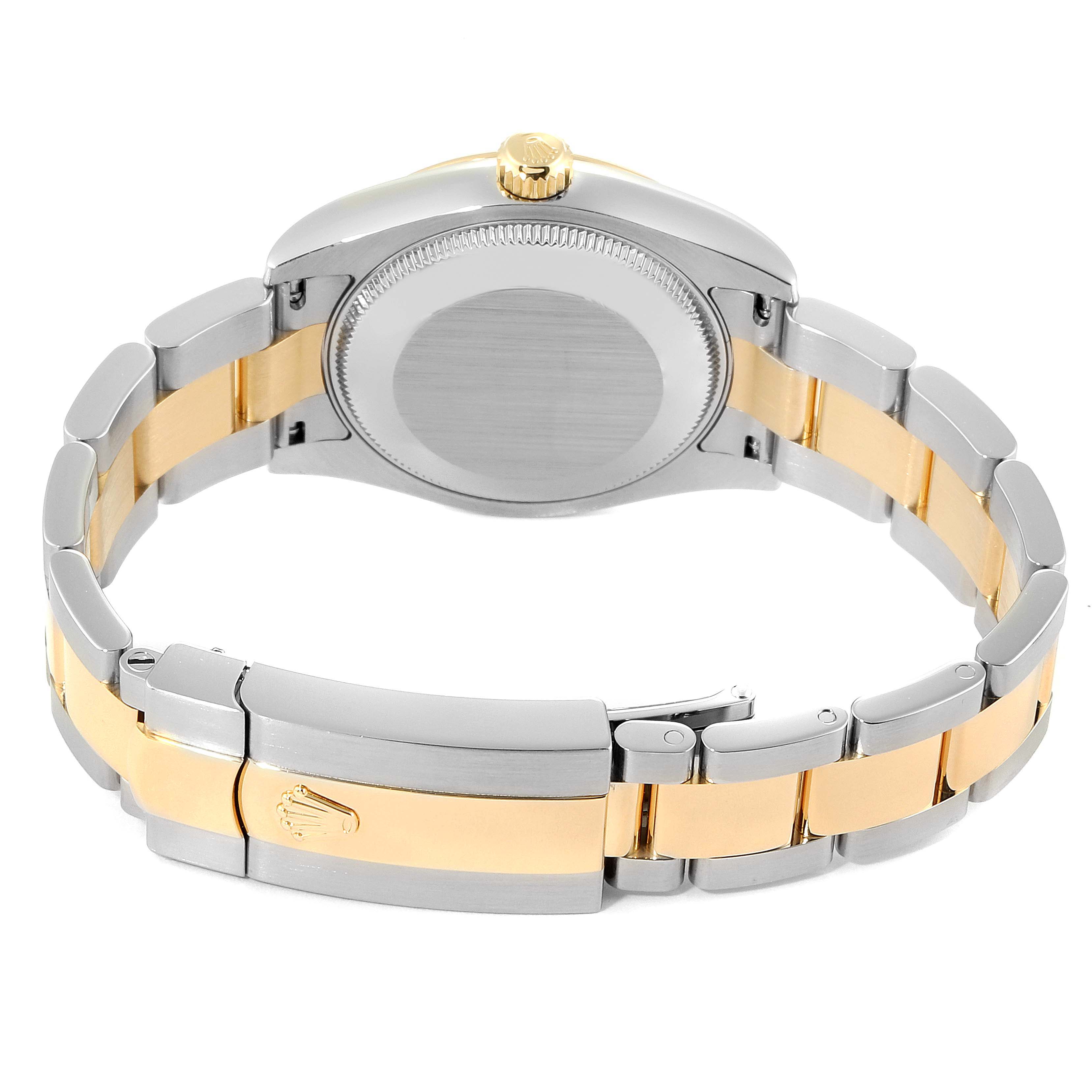 This image shows the back and bracelet of a Mid-Size Rolex watch, capturing the clasp, links, and case back.