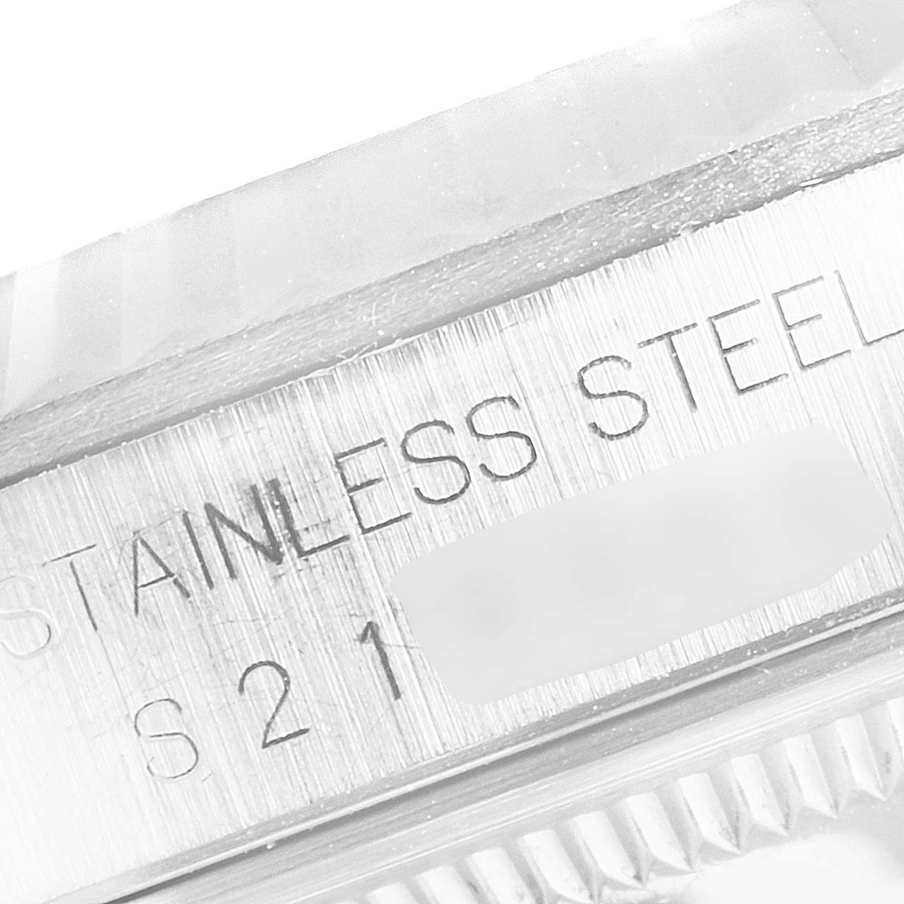 This is a close-up of the case side showing "STAINLESS STEEL" engraving on the Rolex Datejust 16234 Men's Stainless Steel Silver Dial 16234 Men's Stainless Steel Silver Dial watch.