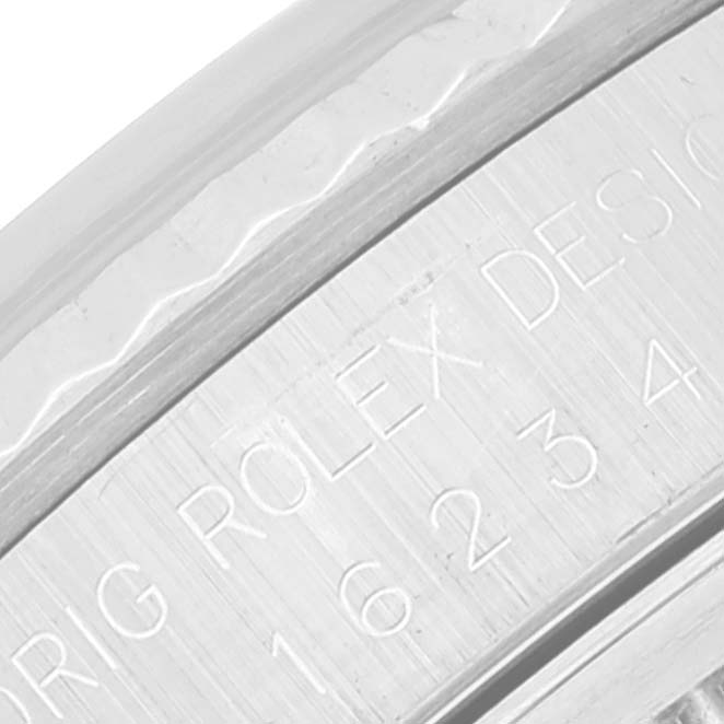 This image shows a close-up of the engraved inner bezel of a Rolex Datejust 16234 Men's Stainless Steel Grey Dial 16234 Men's Stainless Steel Grey Dial watch.