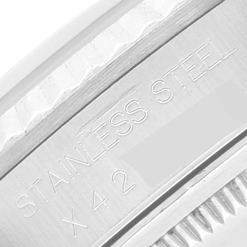 The image shows a close-up view of the side of a Rolex Datejust 16234 Men's Stainless Steel Grey Dial 16234 Men's Stainless Steel Grey Dial watch, focusing on the "STAINLESS STEEL" engraving.