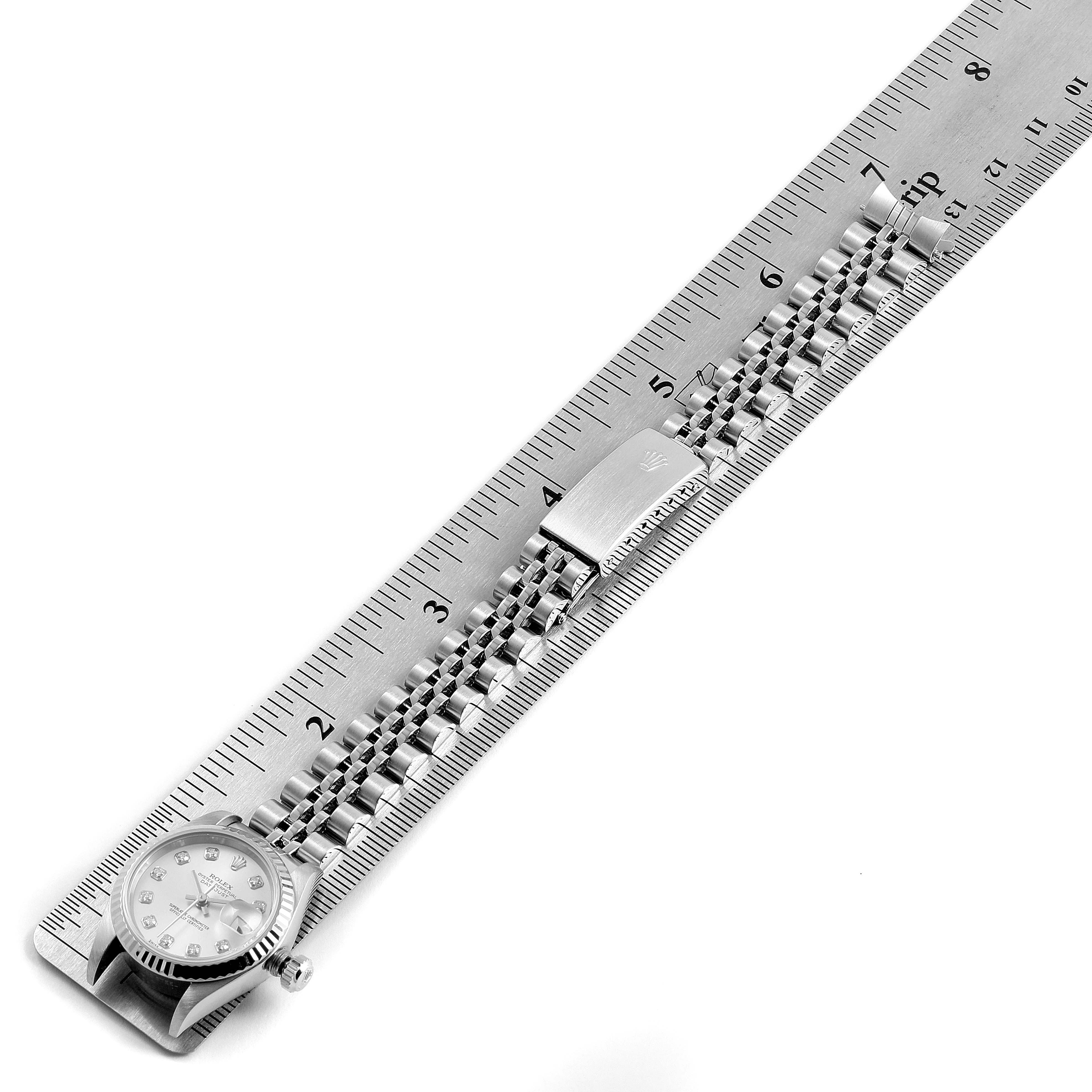 The image shows a Rolex Datejust 79174 Women's Stainless Steel Silver Dial 79174 Women's Stainless Steel Silver Dial watch from an overhead angle, displaying the watch head, dial, bracelet, and clasp against a ruler.