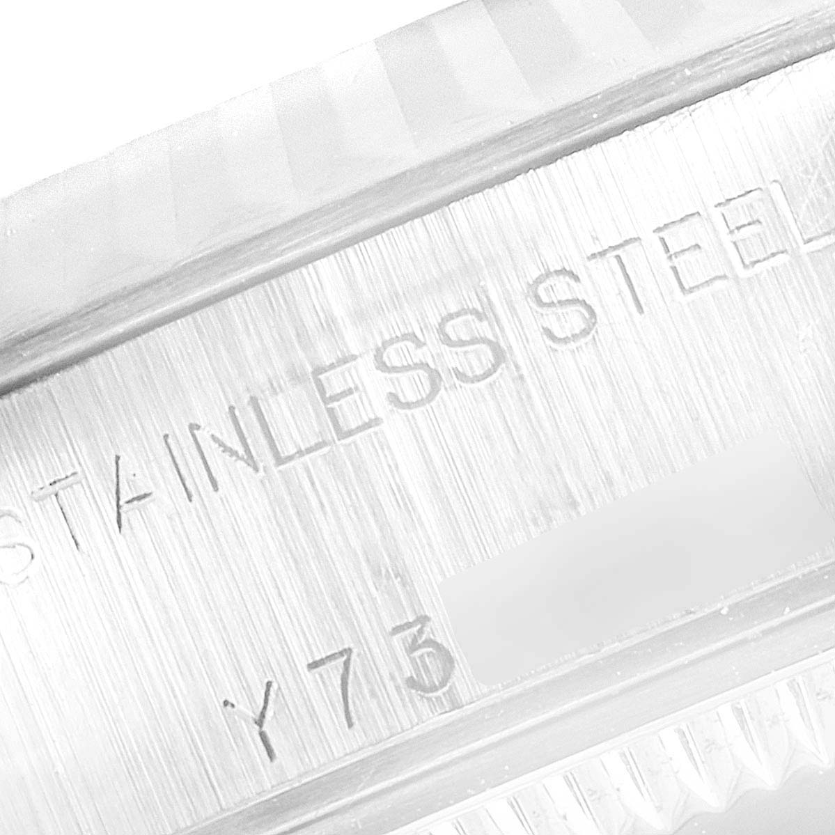 This image shows a close-up of the engraving on the side of the stainless steel case of a Rolex Datejust 79174 Women's Stainless Steel Silver Dial 79174 Women's Stainless Steel Silver Dial watch.