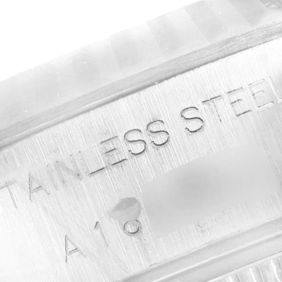 This close-up image shows the engraving on the stainless steel caseback of a Rolex Datejust 79174 Women's Stainless Steel Silver Dial 79174 Women's Stainless Steel Silver Dial watch.