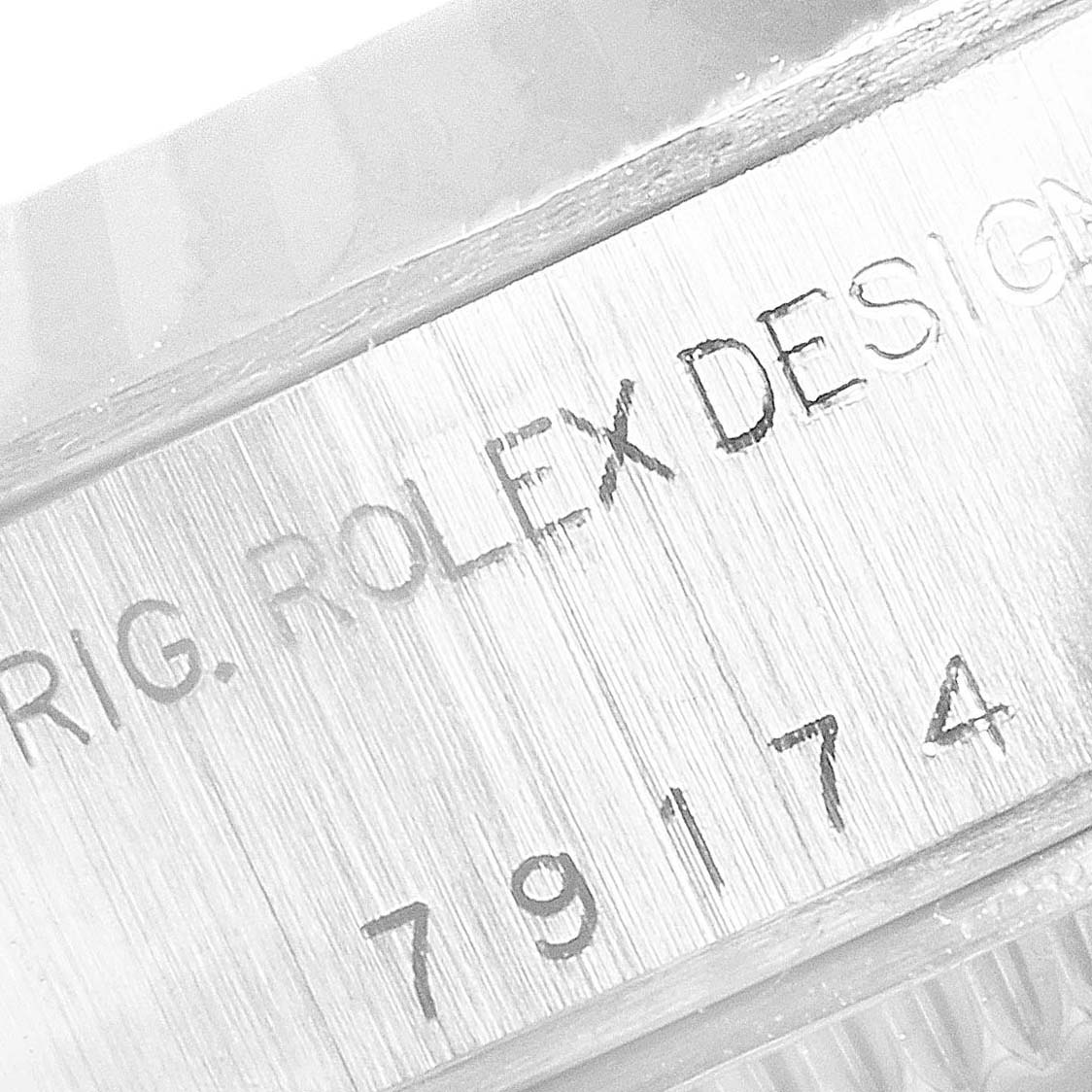 The image shows a close-up of the model number engraving "79174" on the side of the Rolex Datejust 79174 Women's Stainless Steel Silver Dial 79174 Women's Stainless Steel Silver Dial watch.