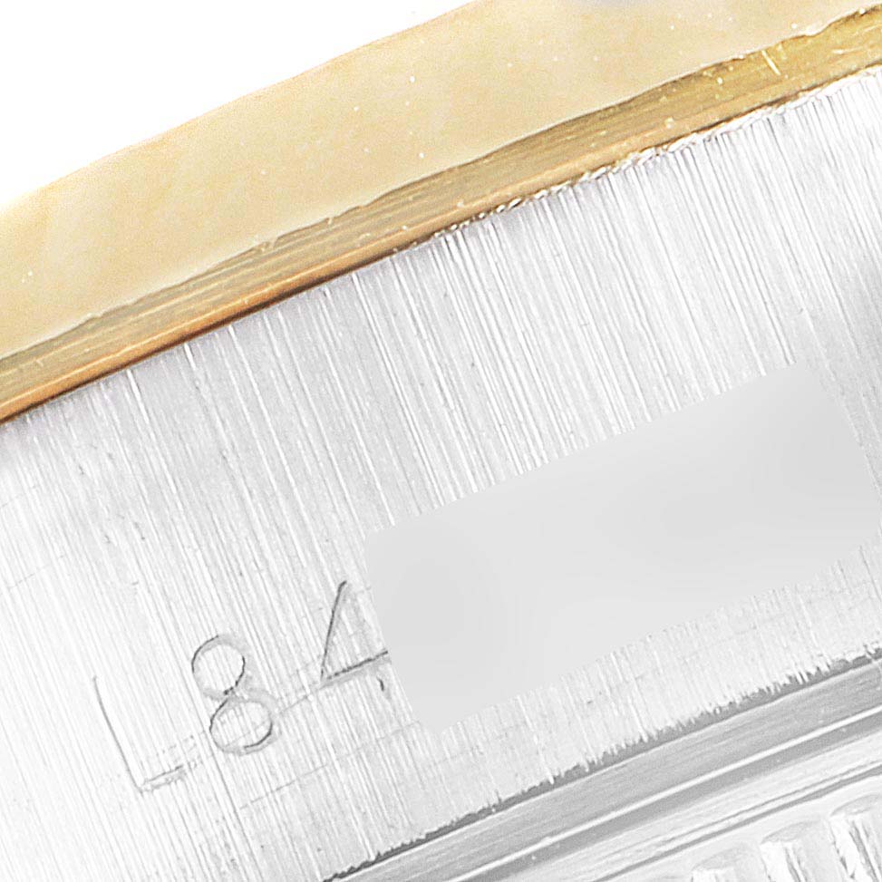 The image shows a close-up of the serial number engraving on the side of a Rolex Datejust 69173 Women's Steel and Gold (two tone) Black Dial 69173 Women's Steel and Gold (two tone) Black Dial watch.
