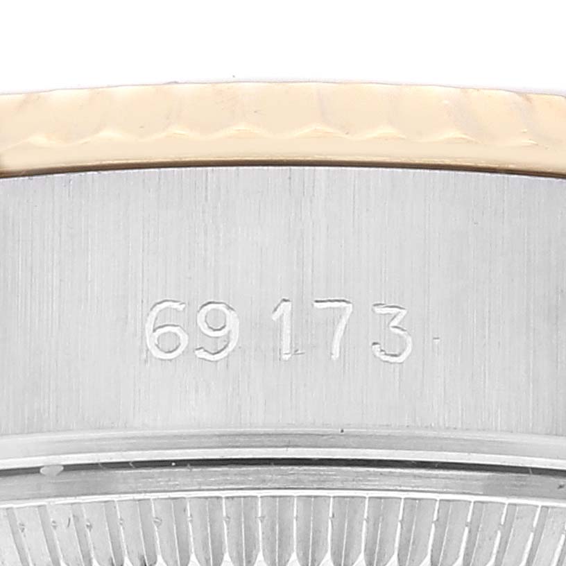 This image shows a close-up of the side of a Rolex Datejust 69173 Women's Steel and Gold (two tone) Champagne Dial 69173 Women's Steel and Gold (two tone) Champagne Dial model, highlighting the engraved reference number.