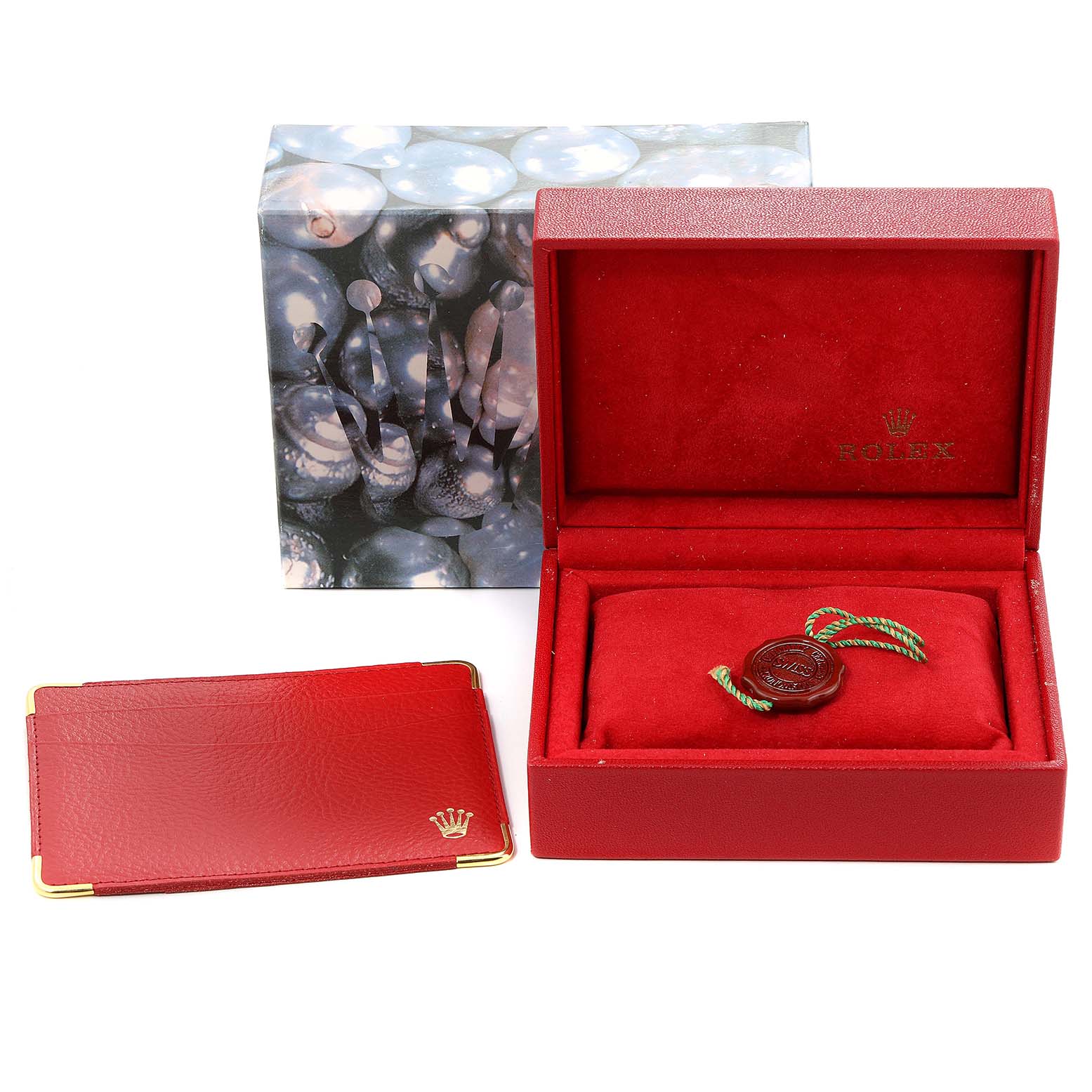 The image shows the Rolex Datejust 69173 Women's Stainless Steel Silver Dial 69173 Women's Stainless Steel Silver Dial packaging, including the watch box, a leather cardholder, and a hang tag.