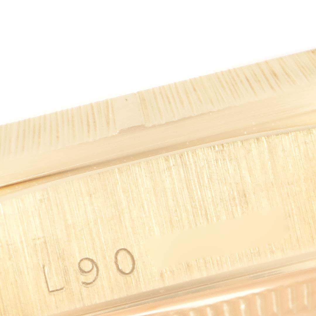 This image shows a close-up of the side case and part of the bezel of a Rolex President 18248 Men's Yellow Gold White Dial 18248 Men's Yellow Gold White Dial model watch.