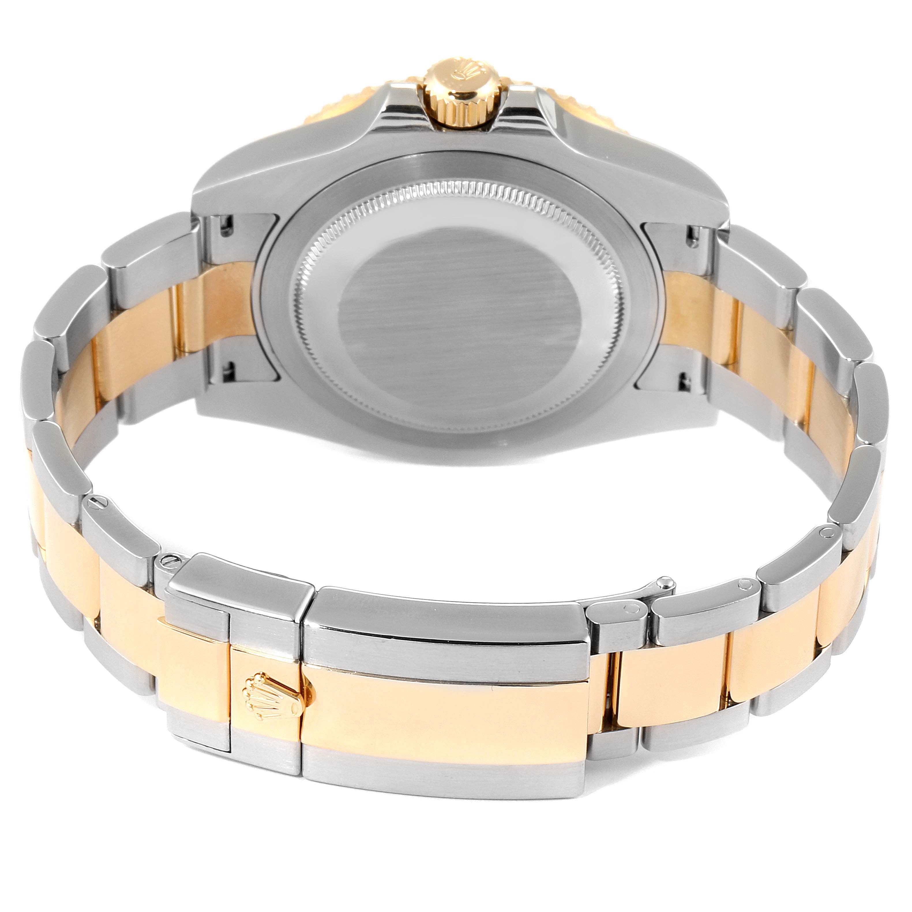 This image shows the back and bracelet of the Rolex GMT-Master 116713 Men's Steel and Gold (two tone) Black Dial 116713 Men's Steel and Gold (two tone) Black Dial watch, highlighting its two-tone metal design.