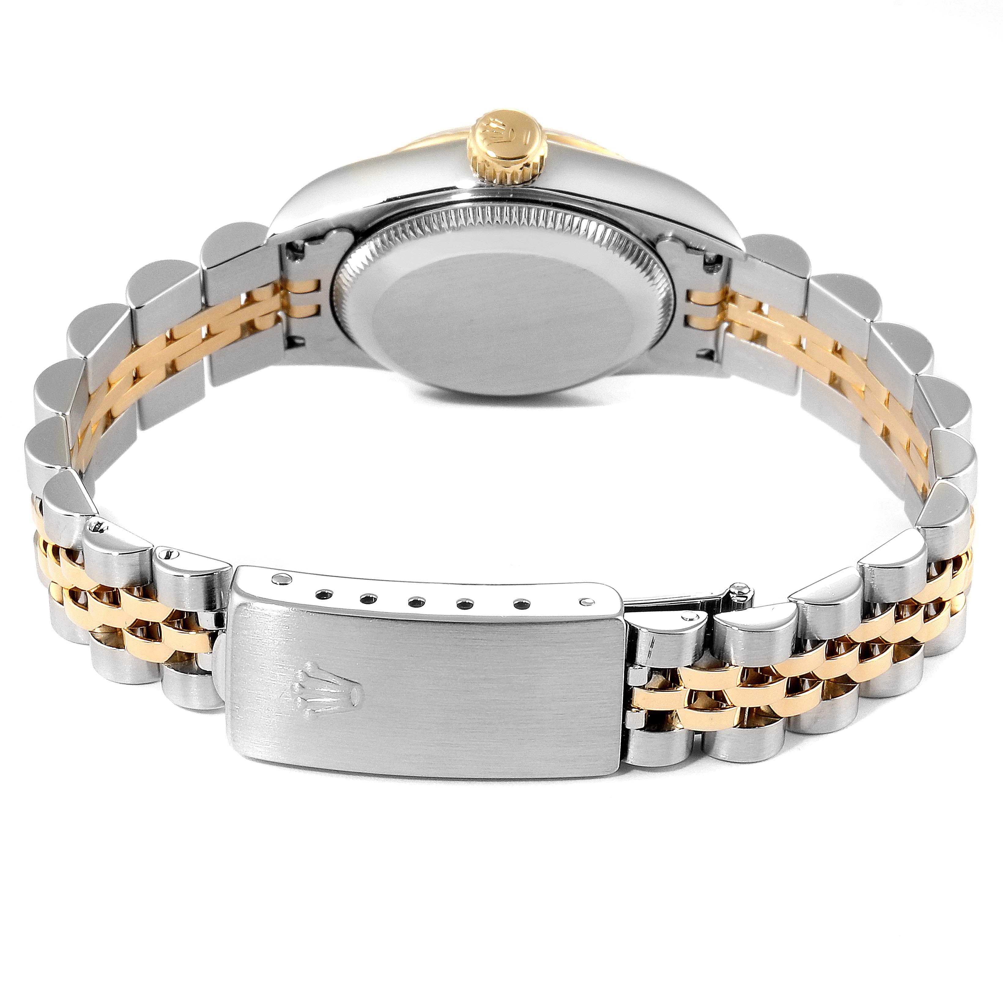 This image shows the back side of a Rolex Oyster Perpetual 67193 Women's Steel and Gold (two tone) Black Dial 67193 Women's Steel and Gold (two tone) Black Dial watch, highlighting the case back and bracelet clasp.