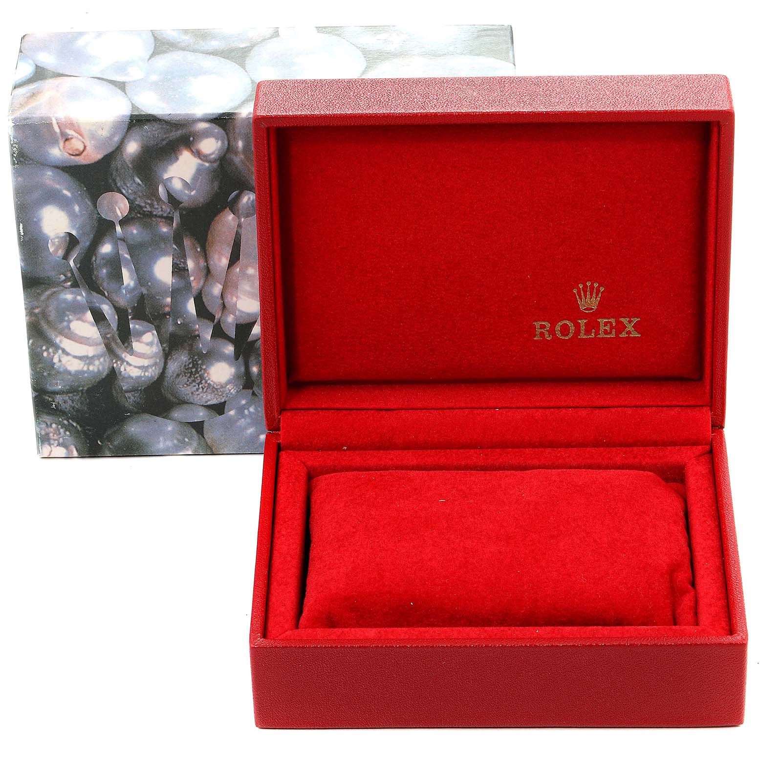The image shows a red Rolex watch box, likely for the Oyster Perpetual model, with the lid open and the watch cushion inside.