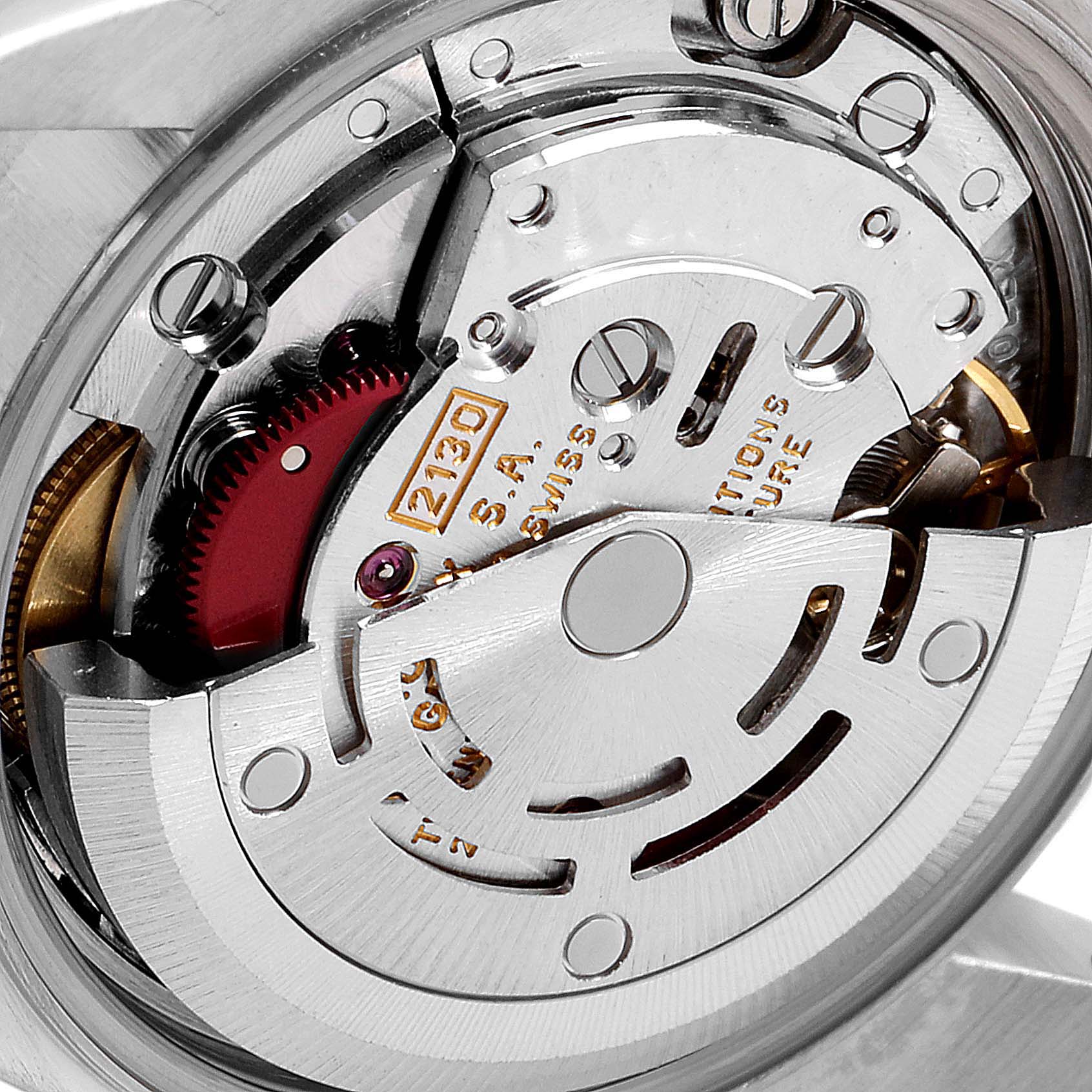 The image shows the internal movement of a Rolex Oyster Perpetual 67193 Women's Steel and Gold (two tone) Black Dial 67193 Women's Steel and Gold (two tone) Black Dial watch from a close-up, angled view.