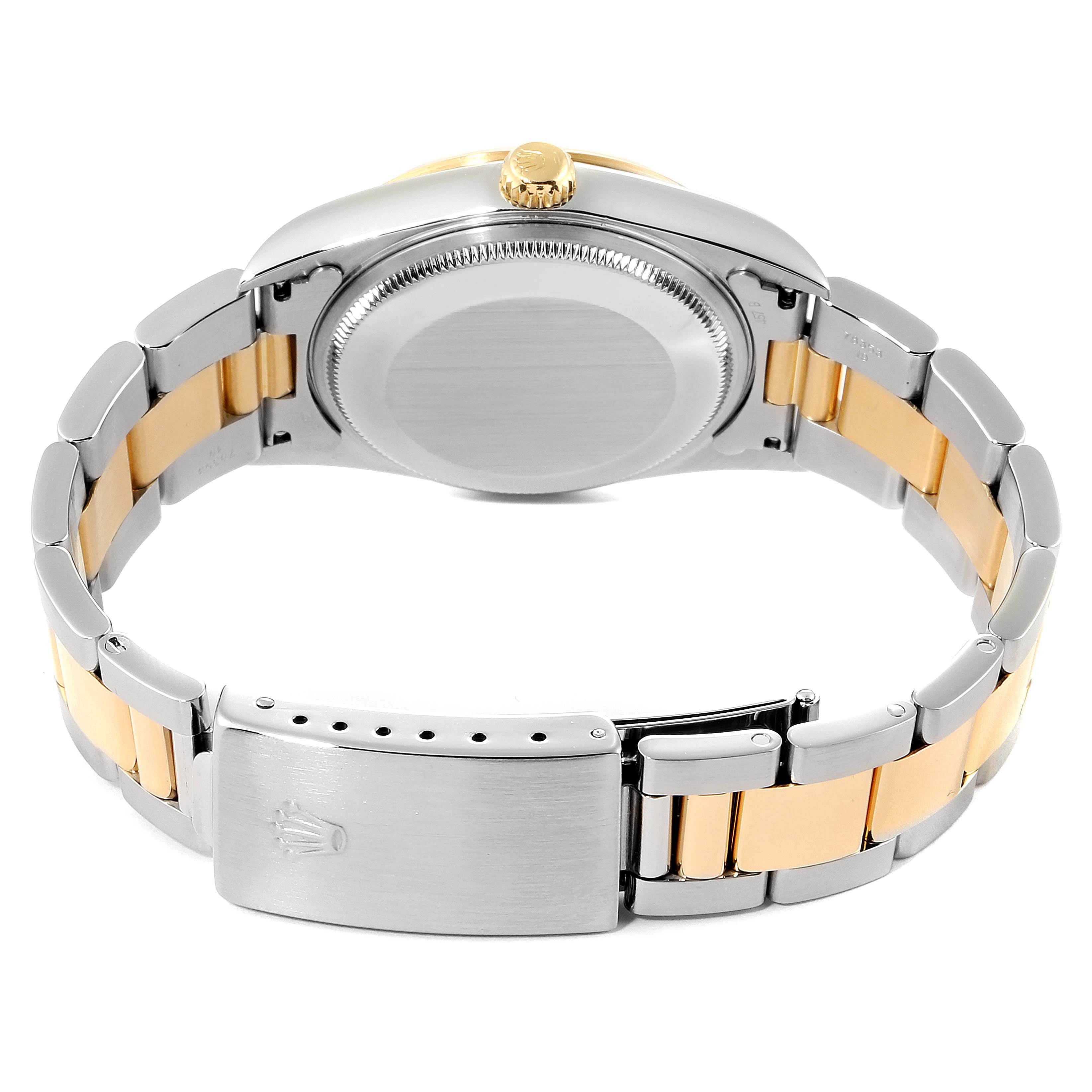 The image shows the back of a Rolex Oyster Perpetual 14203 Men's Steel and Gold (two tone) Champagne Dial 14203 Men's Steel and Gold (two tone) Champagne Dial watch, highlighting the bracelet, clasp, and case back.