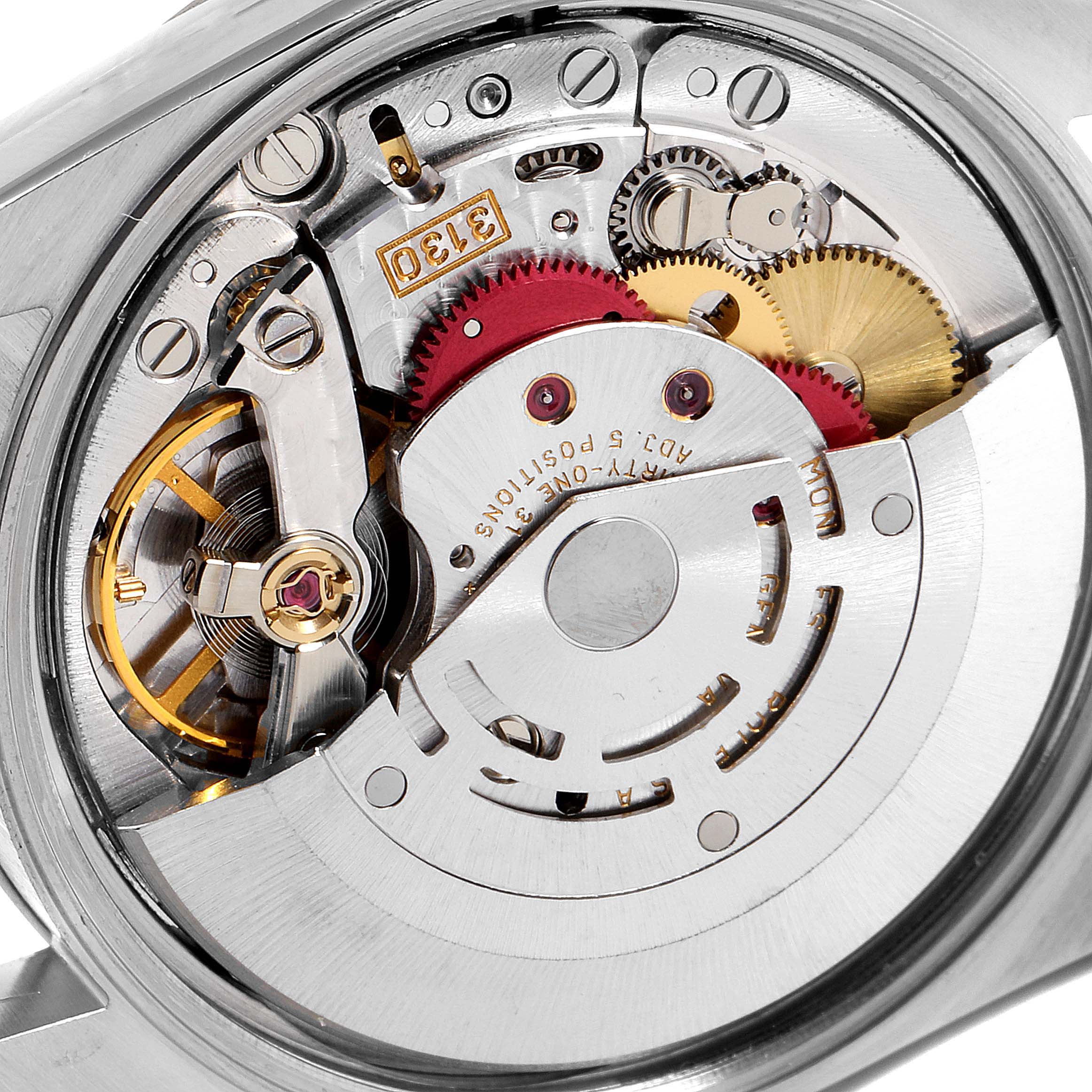 This image shows a close-up of the movement mechanism of a Rolex Oyster Perpetual 14203 Men's Steel and Gold (two tone) Champagne Dial 14203 Men's Steel and Gold (two tone) Champagne Dial watch.
