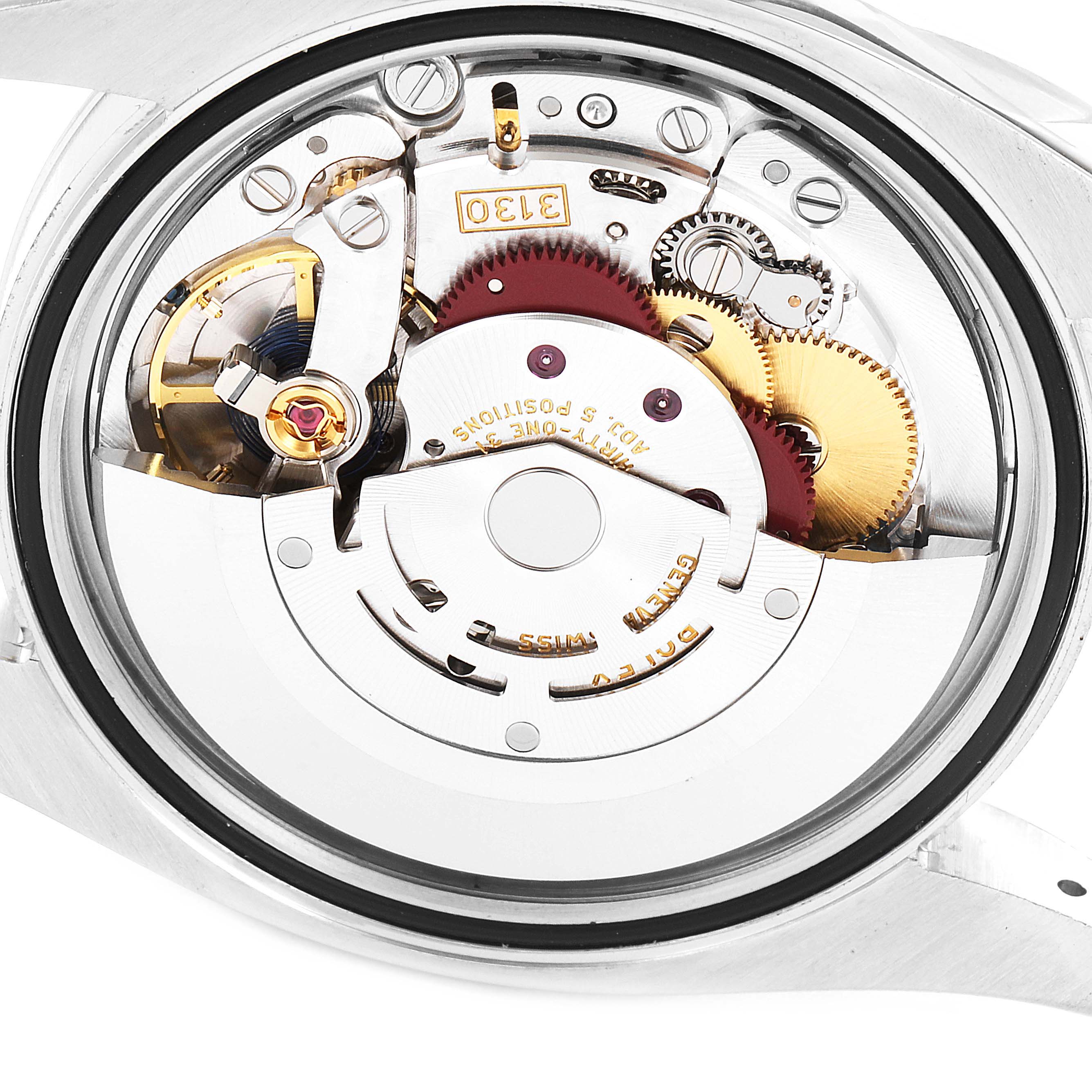This image shows the inner movement mechanism of the Rolex Oyster Perpetual 116000 Men's Stainless Steel Grey Dial 116000 Men's Stainless Steel Grey Dial watch from a rear angle with the case back removed.