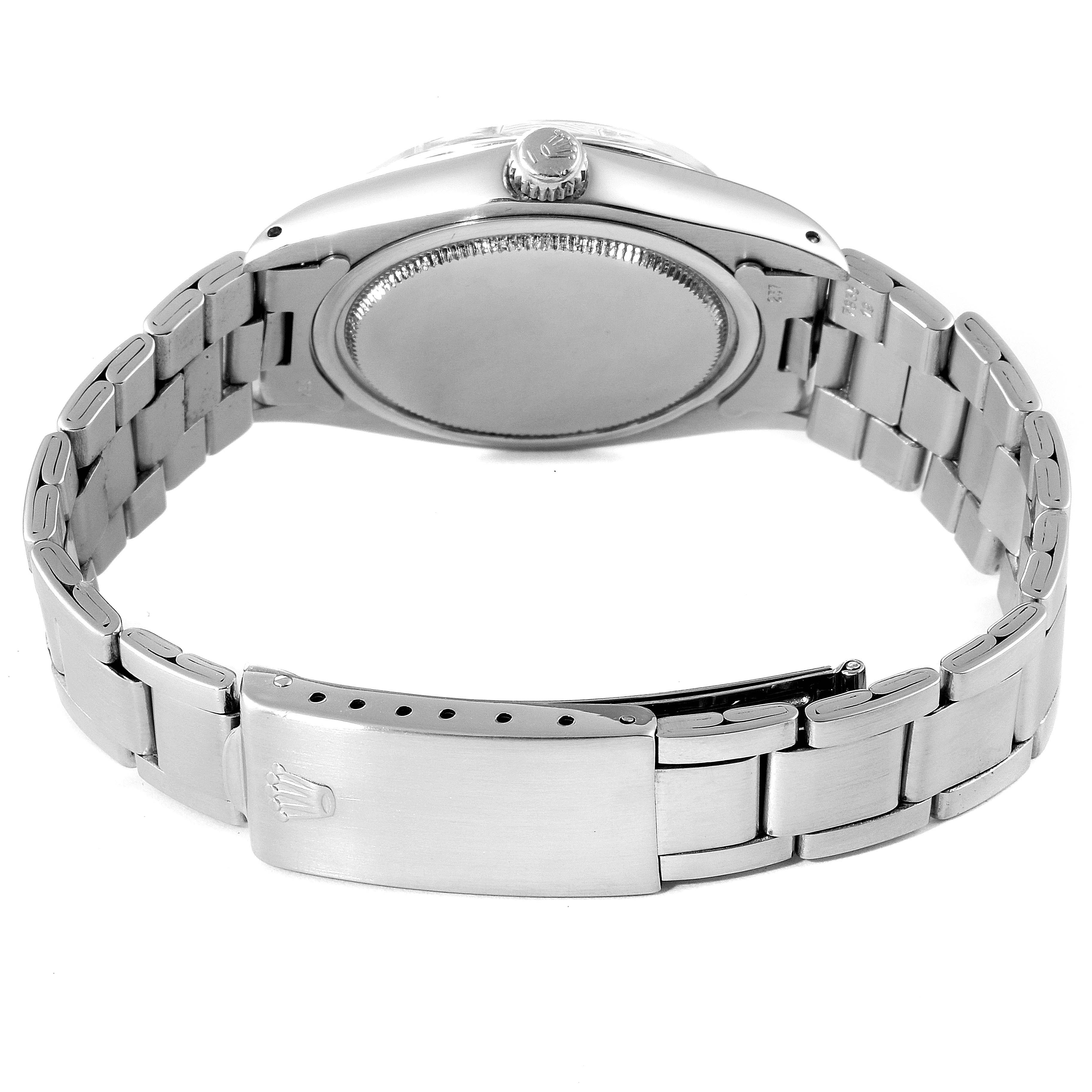 The image shows the back view of the Rolex Vintage Collection 6694 Men's Stainless Steel Silver Dial 6694 Men's Stainless Steel Silver Dial model, highlighting the clasp, bracelet, and case back.