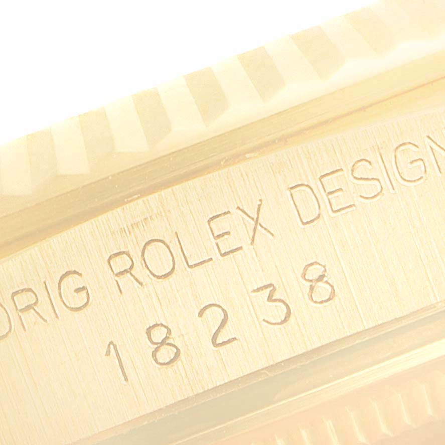 This image shows a close-up of the case side engraving on a Rolex President 18238 Men
s Yellow Gold Black Dial 18238 Men
s Yellow Gold Black Dial model watch.