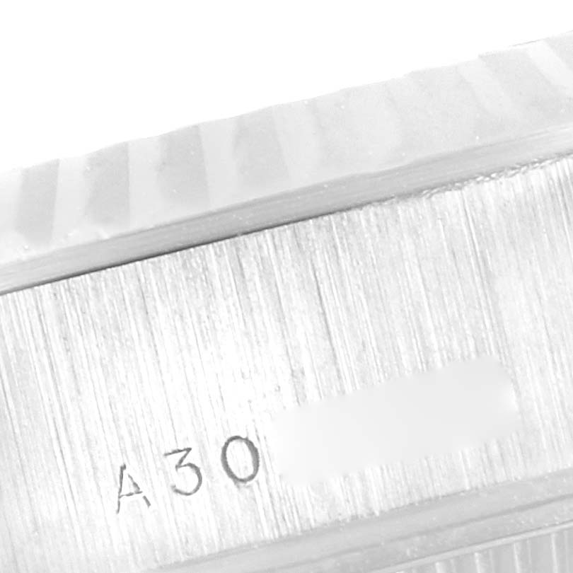 This image shows a close-up of the edge of the case and part of the fluted bezel of a Rolex President 79179 Women's White Gold Silver Dial 79179 Women's White Gold Silver Dial model watch.