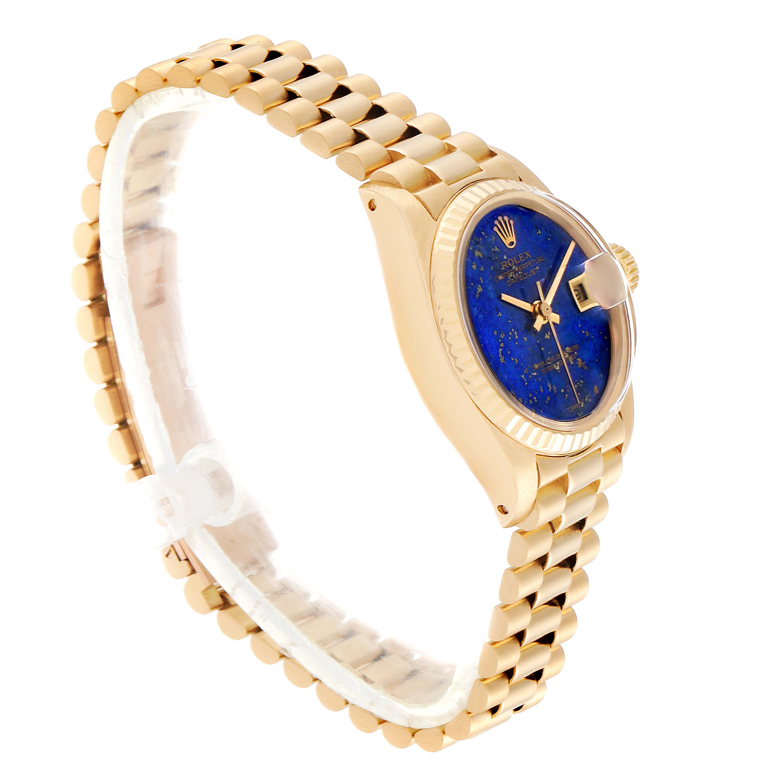 This image shows a Rolex President 6917 Women's Yellow Gold Blue Dial 6917 Women's Yellow Gold Blue Dial model watch at an angled side view, highlighting the blue dial, fluted bezel, and the President bracelet.