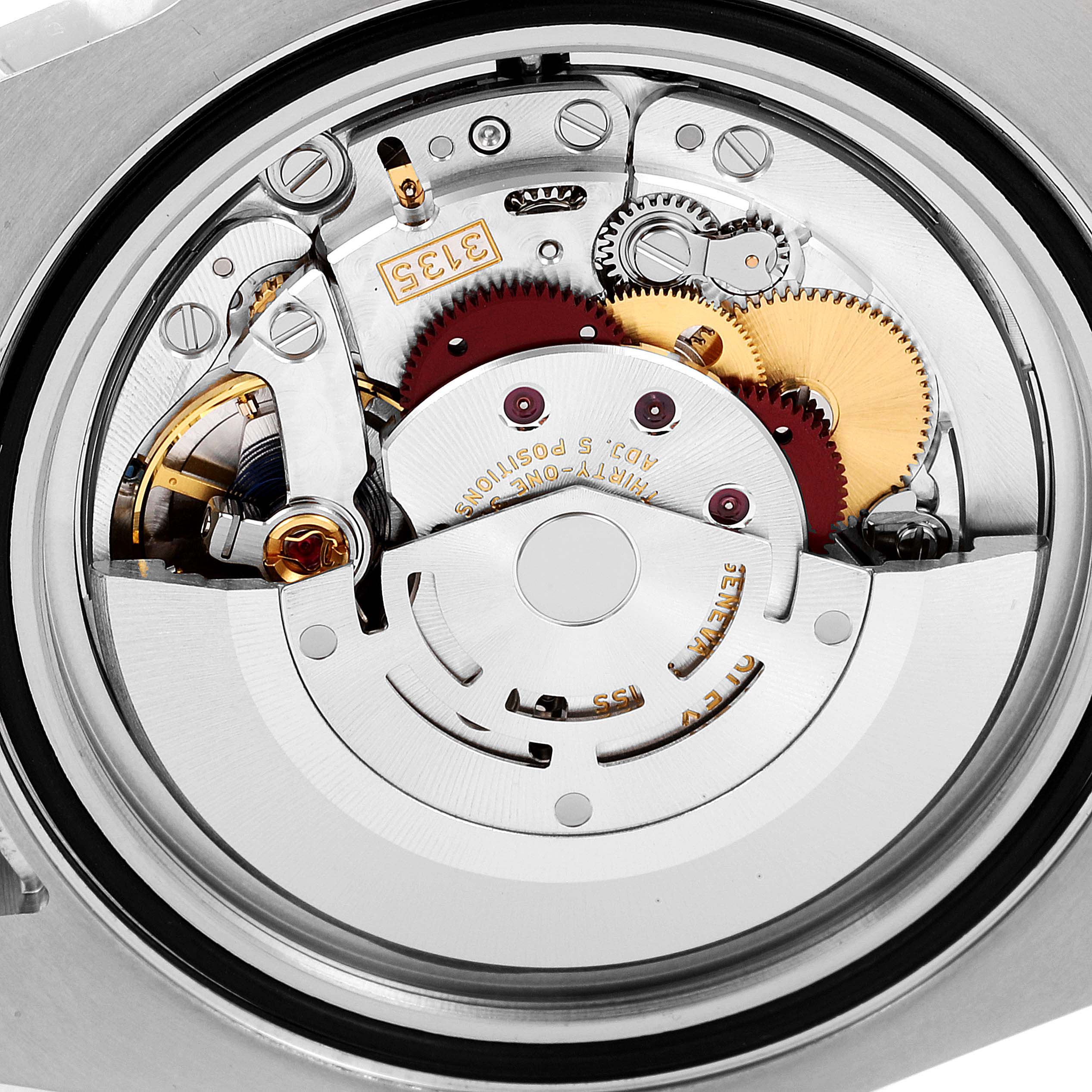 The image shows a close-up view of the internal movement mechanism of a Rolex Submariner 116610LN Men
s Stainless Steel Black Dial 116610LN Men
s Stainless Steel Black Dial watch.