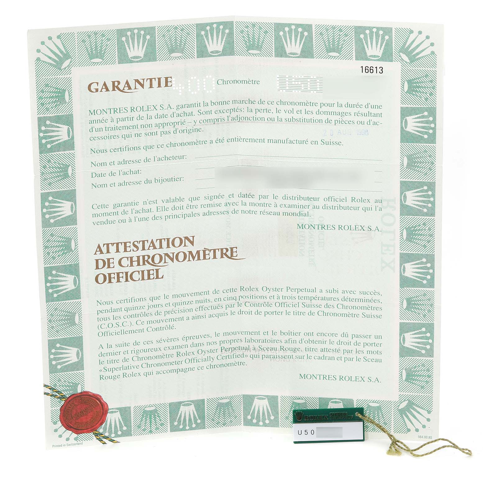 The image shows a warranty and certification document for the Rolex Submariner 16613 Men's Steel and Gold (two tone) Blue Dial 16613 Men's Steel and Gold (two tone) Blue Dial model, including a seal and serial number tag.