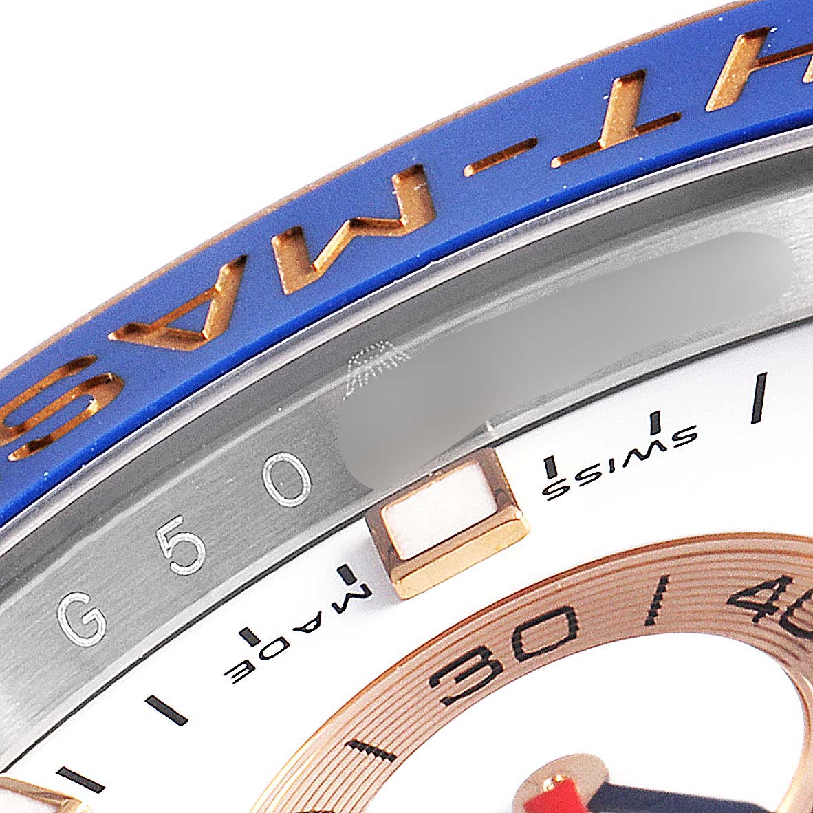 The image shows a close-up of the bezel and partial dial of a Rolex Yacht-Master 116681 Men
s Steel and Gold (two tone) White Dial 116681 Men
s Steel and Gold (two tone) White Dial watch, prominently featuring its blue and gold details.