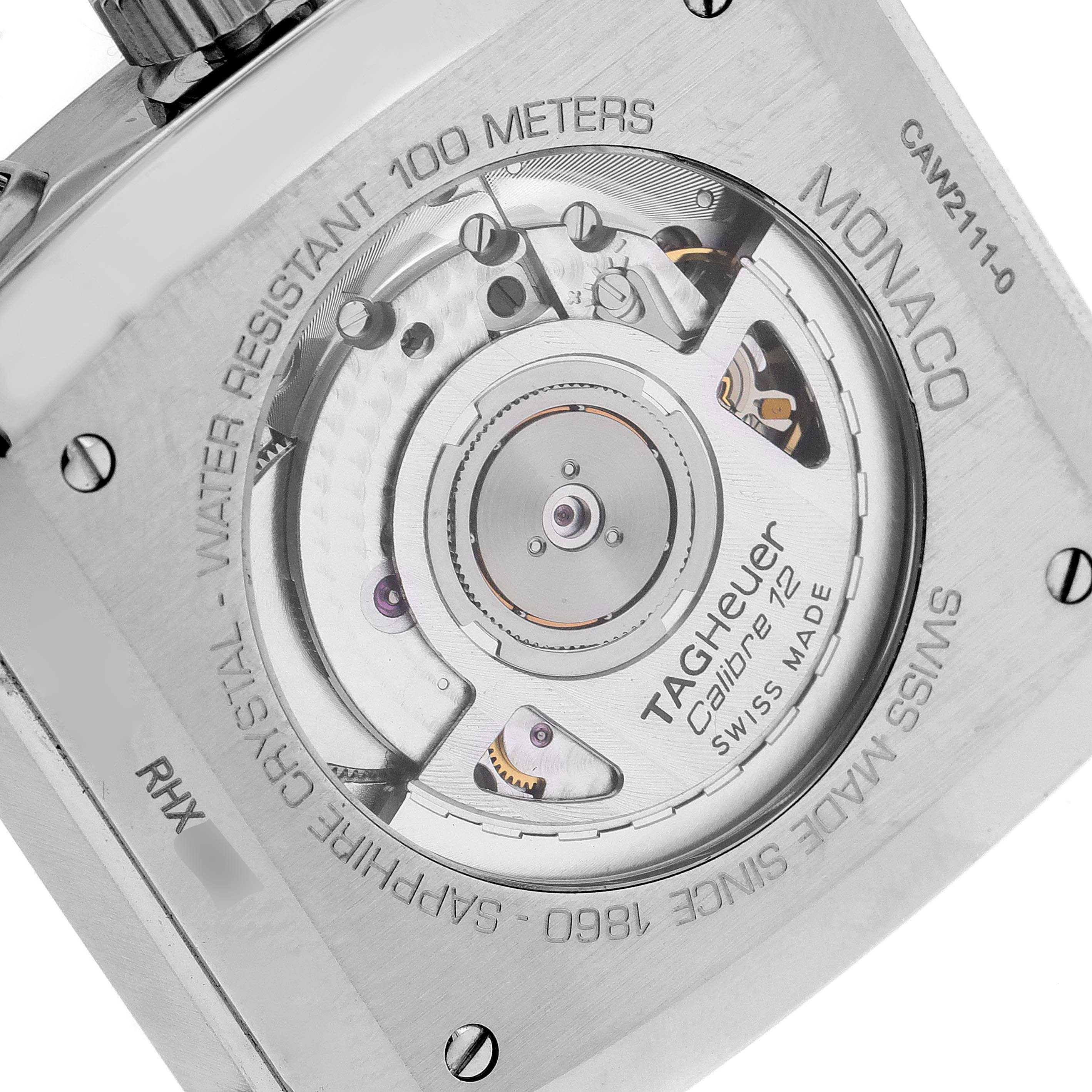 The image shows the back of the Tag Heuer Monaco CAW2111 Men's Stainless Steel Blue Dial CAW2111 Men's Stainless Steel Blue Dial watch, highlighting its movement and engravings.