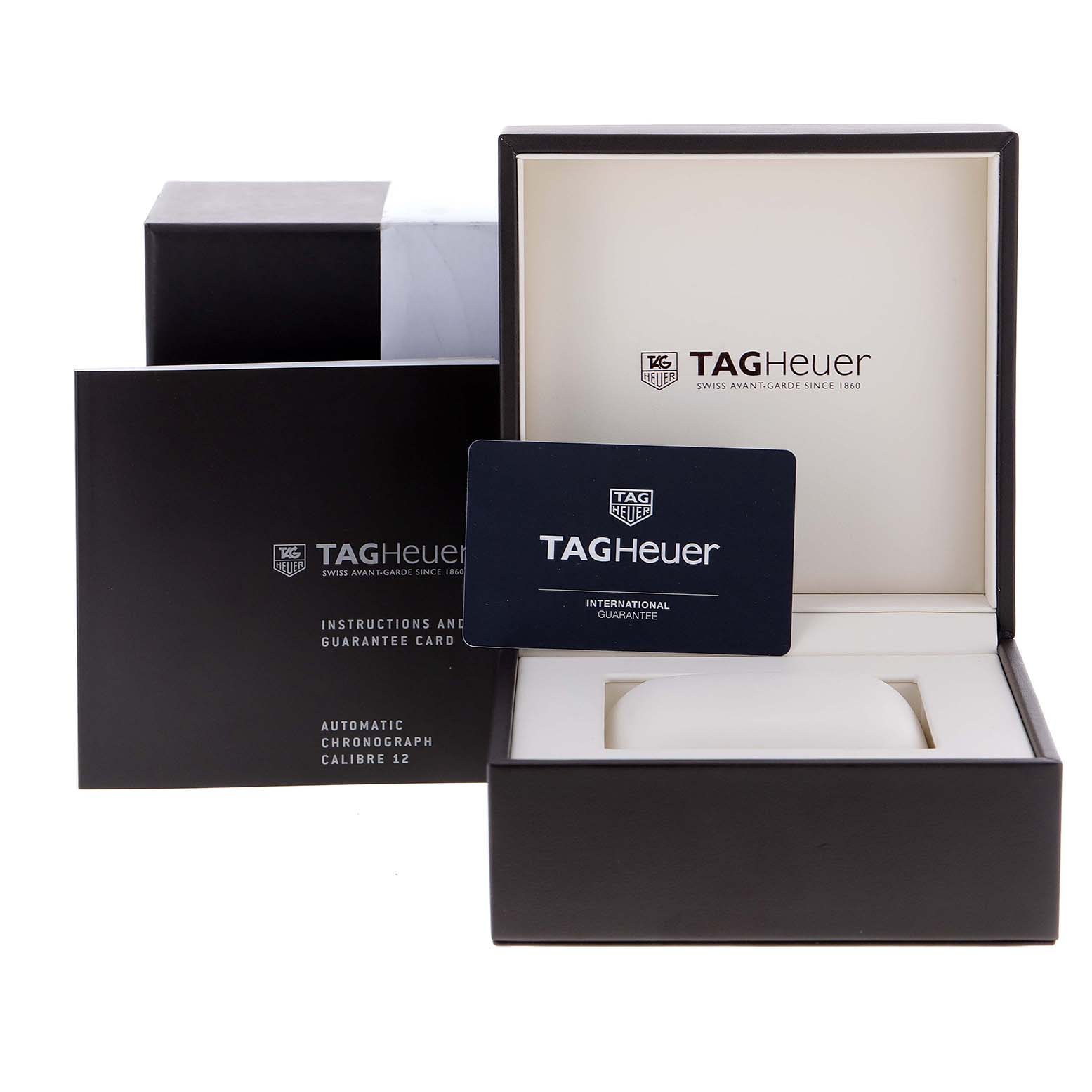 The image shows the packaging, instruction manual, and international guarantee card for a Tag Heuer Monaco CAW2111 Men's Stainless Steel Blue Dial CAW2111 Men's Stainless Steel Blue Dial watch.