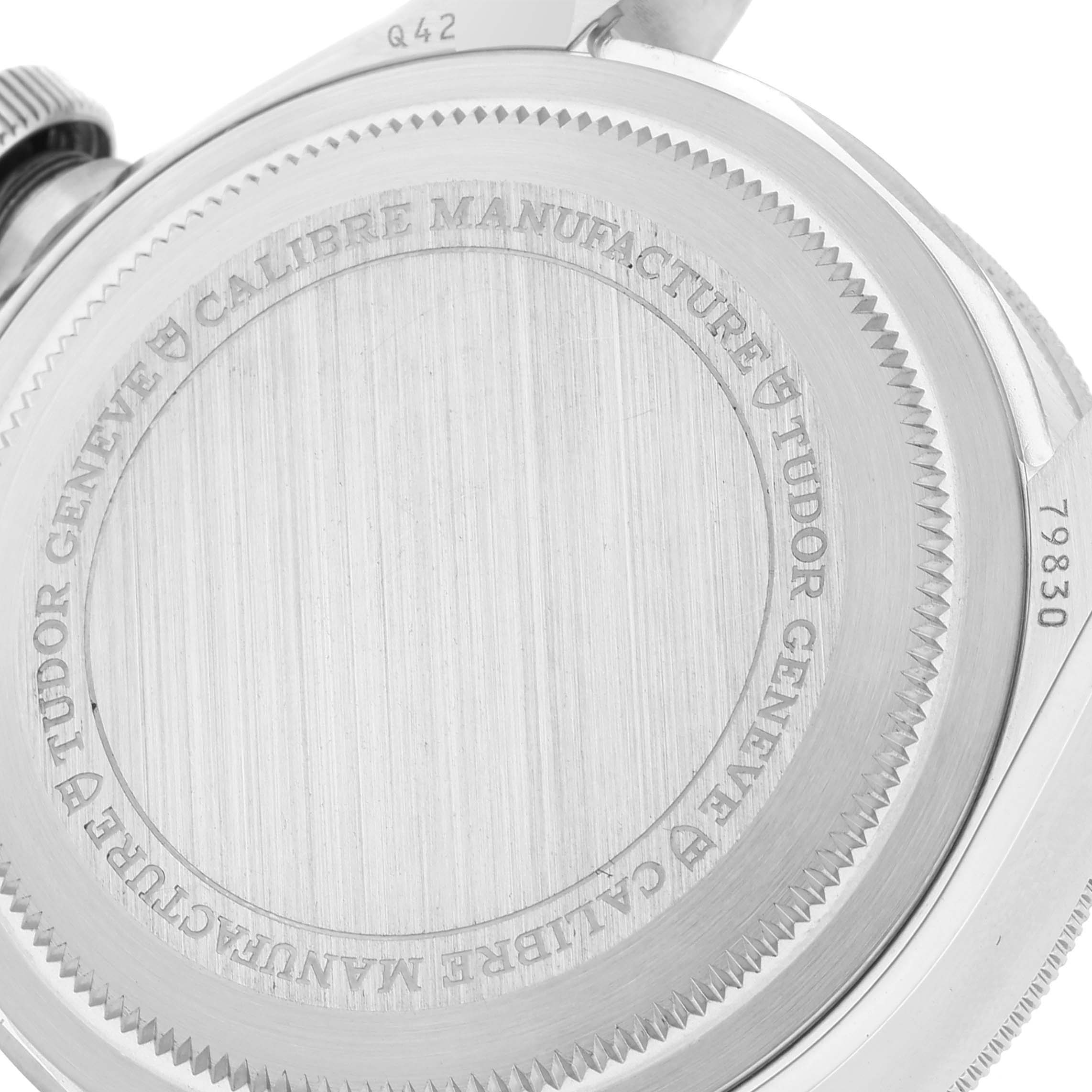 This is a close-up view of the back casing of the Tudor Heritage Black Bay 79830RB Men
s Stainless Steel Black Dial 79830RB Men
s Stainless Steel Black Dial watch, showcasing its engraving details.