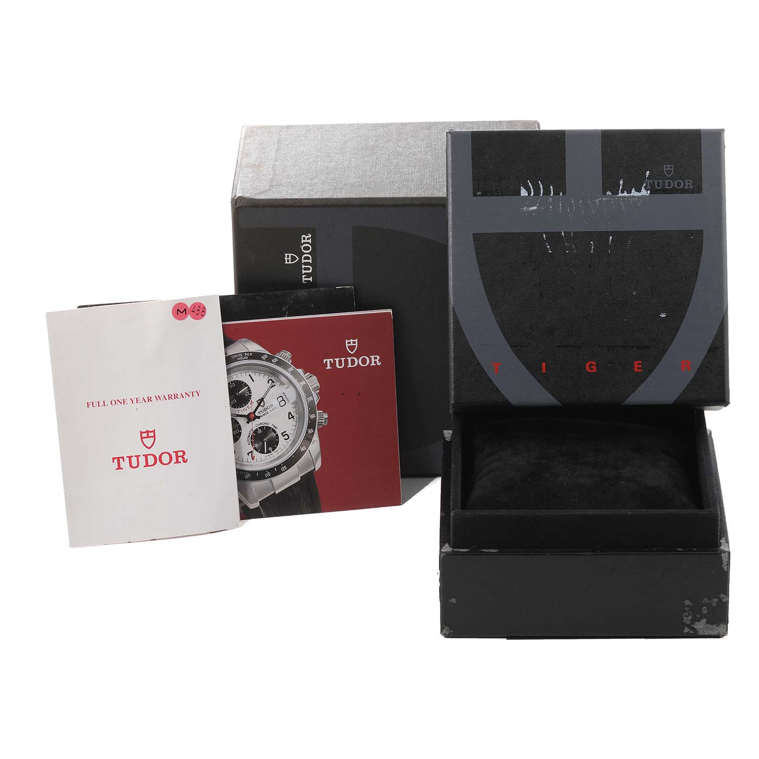 The image shows a Tudor Prince model watch box, an inner cushion, warranty card, and instructional booklet from a front angle.