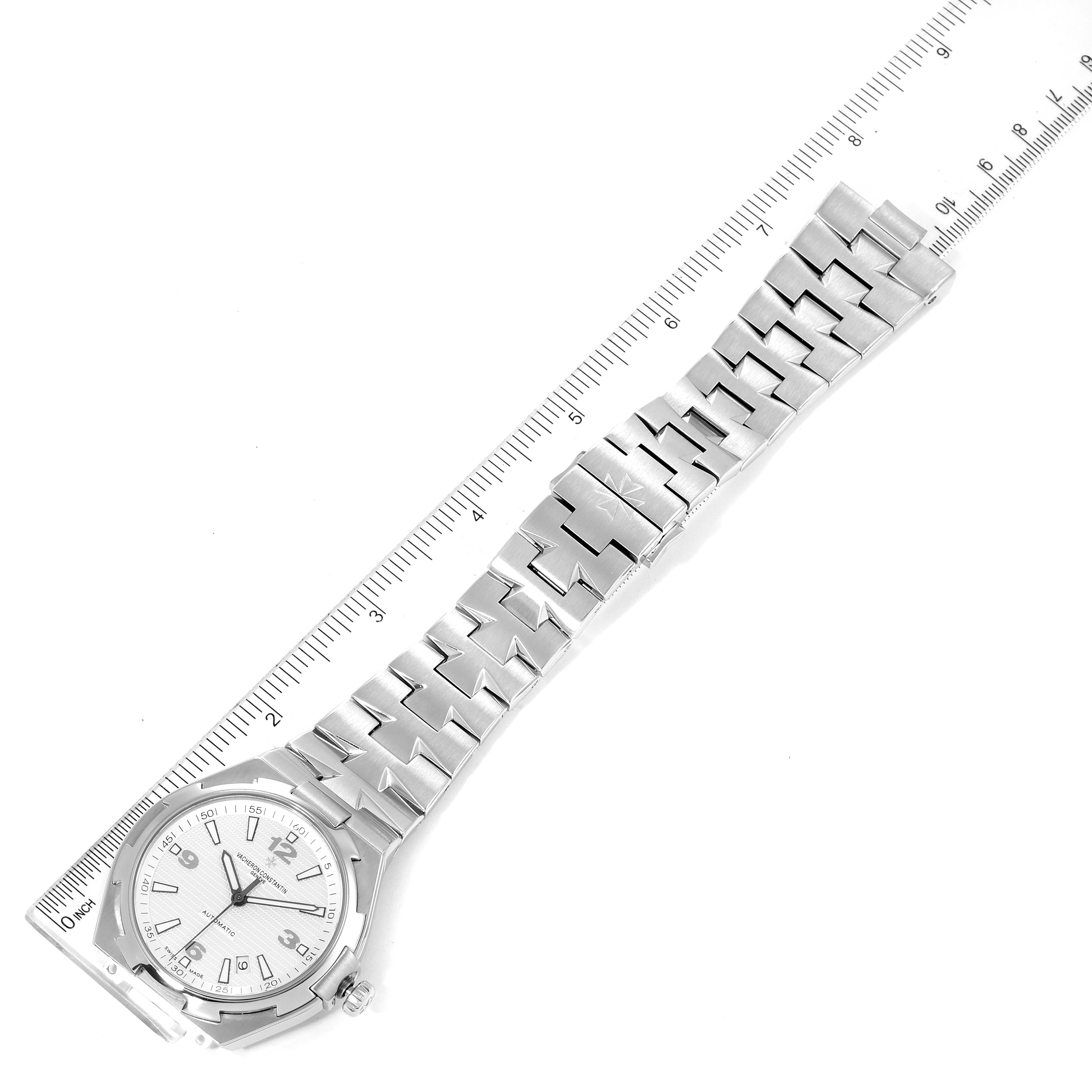 The image shows a Vacheron Constantin Overseas 47040B01A-9093 Men
s Stainless Steel Silver Dial 47040B01A-9093 Men
s Stainless Steel Silver Dial watch from a top-down angle, featuring the dial, bezel, and bracelet.