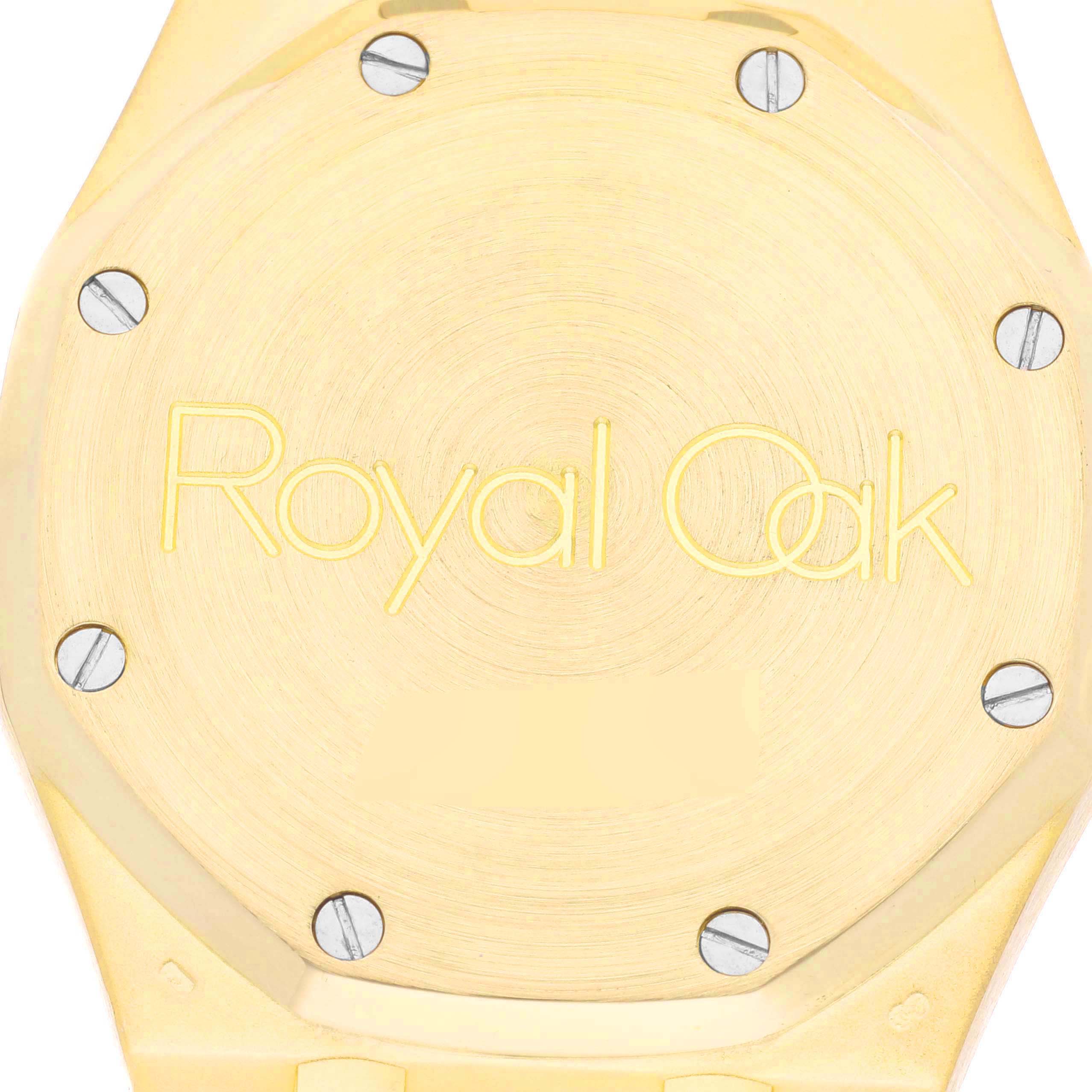 The image shows the case back of a Royal Oak model watch by Audemars Piguet, featuring the engraved model name and visible screws.